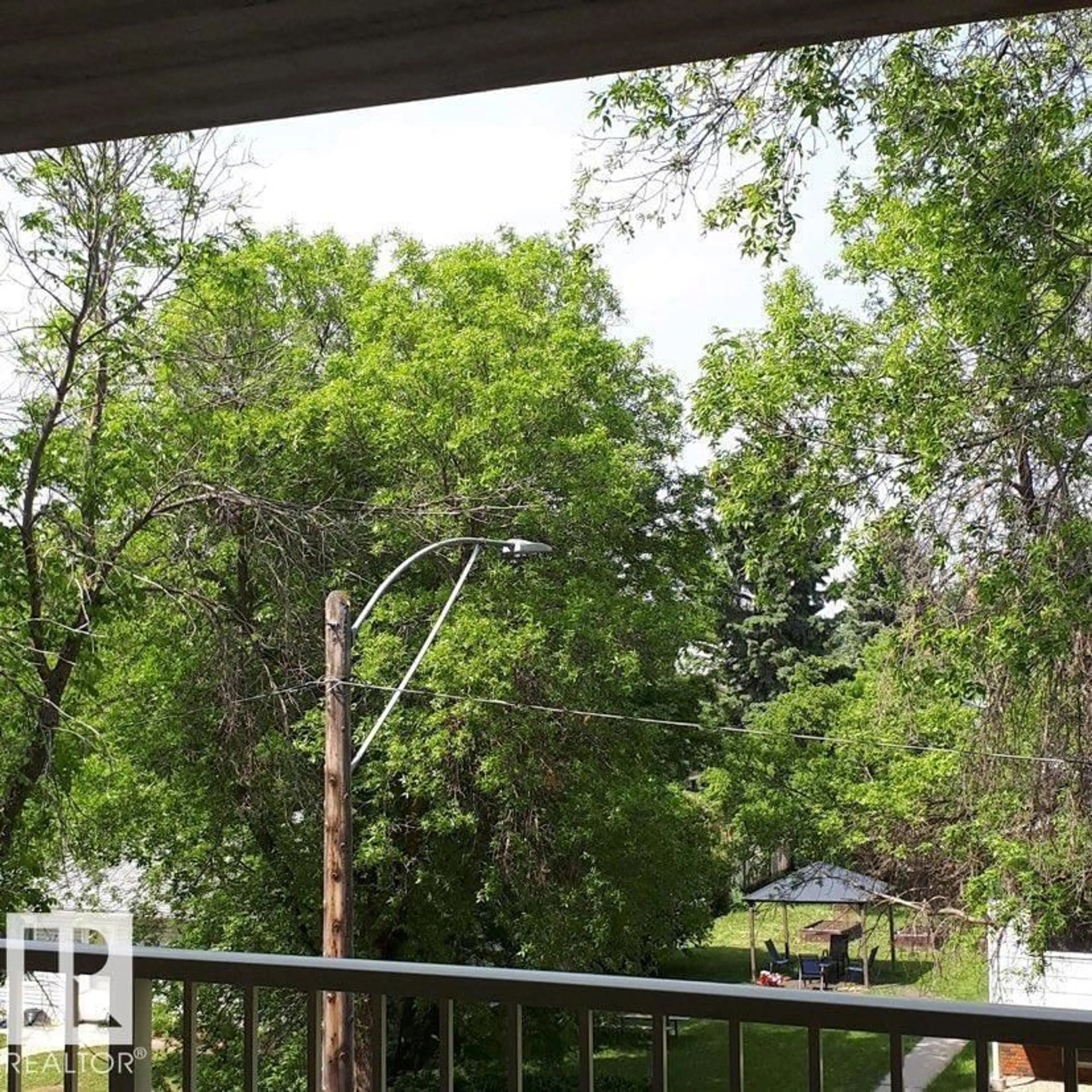 Patio, forest/trees view for #302 - 4707 51 AV NW, Wetaskiwin Alberta T9A0T6