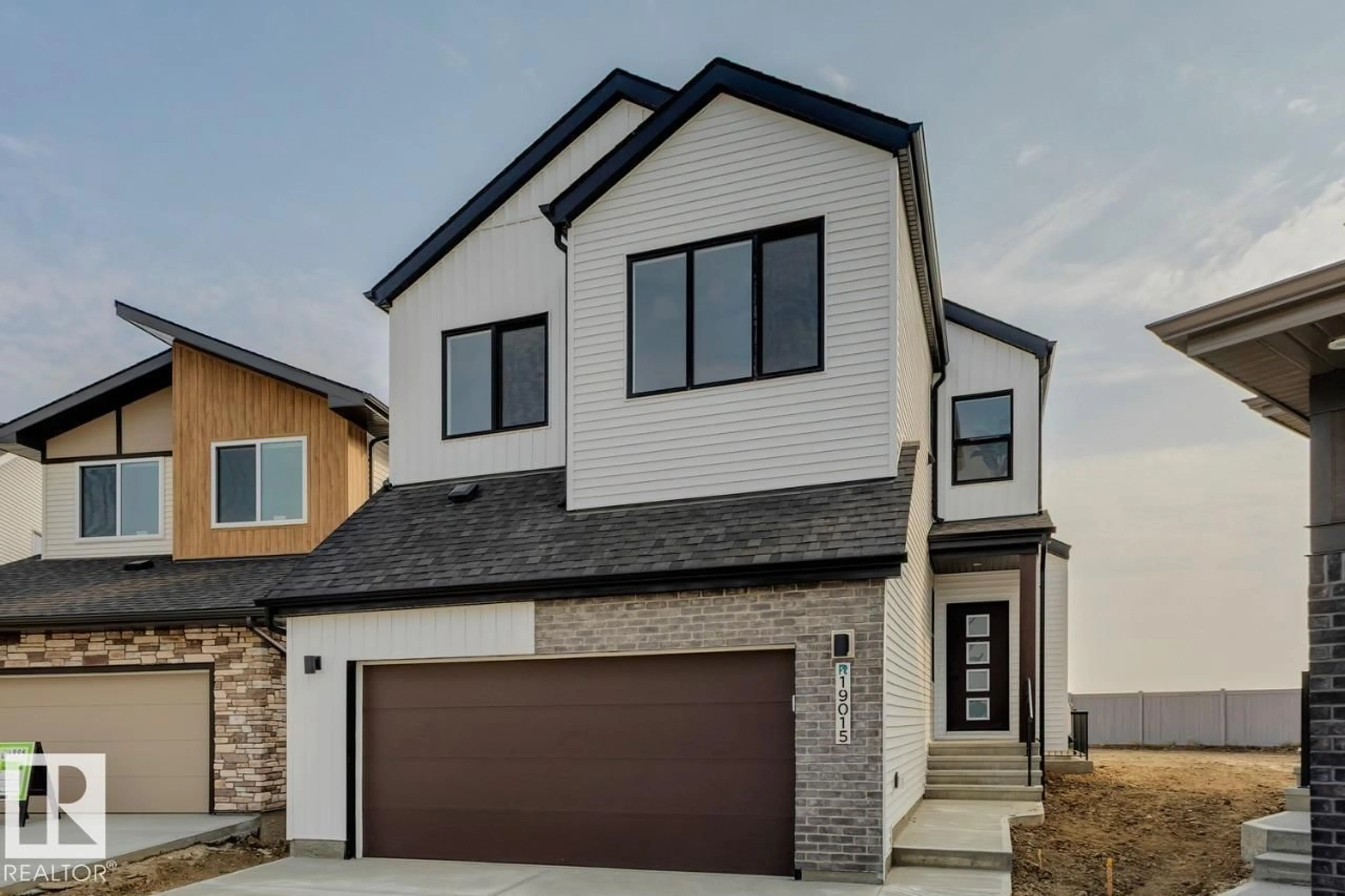 Home with brick exterior material, street for 19015 20 AV, Edmonton Alberta T6M3A7