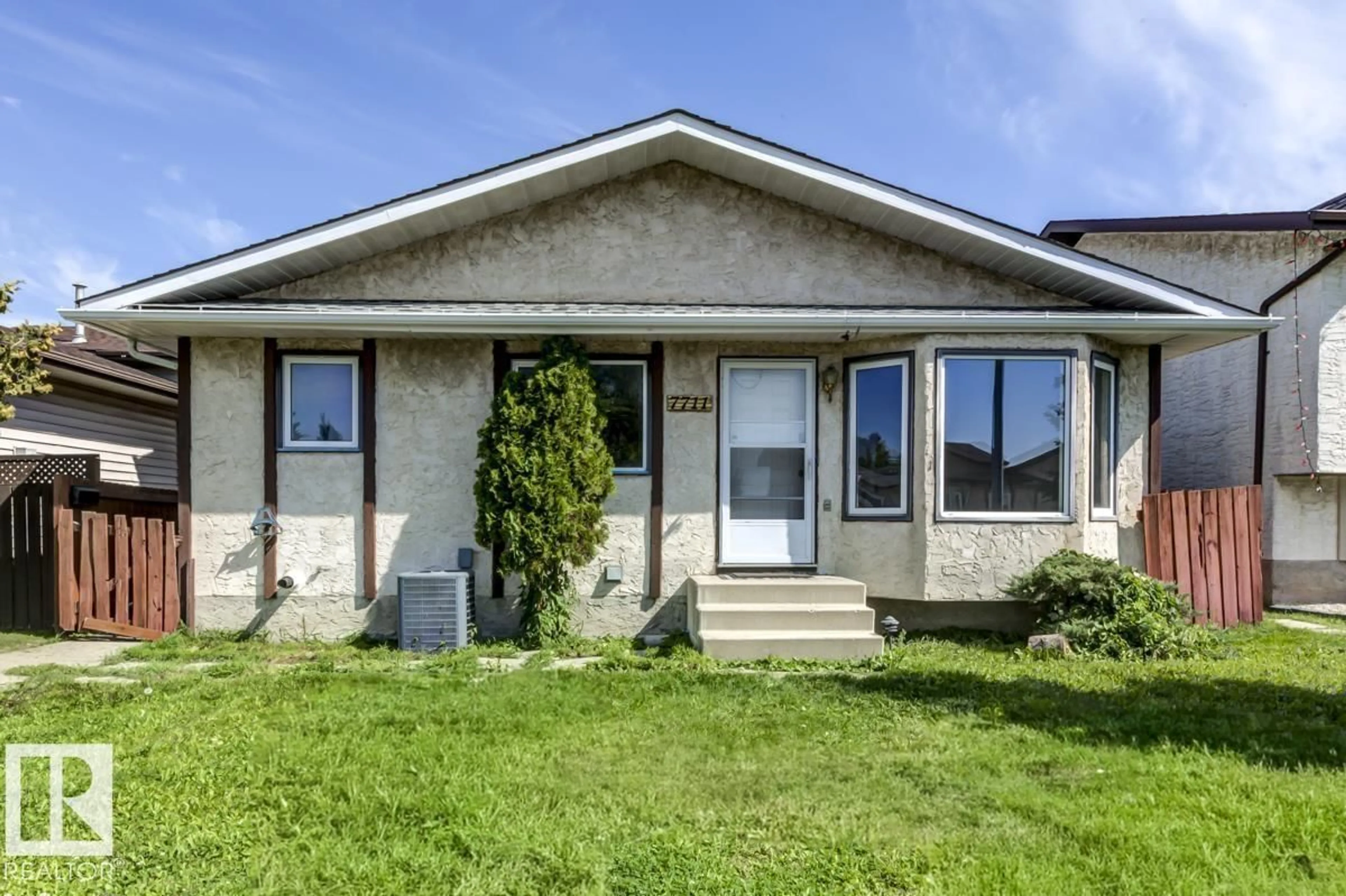 Home with vinyl exterior material, street for NW - 7711 189 ST, Edmonton Alberta T5T5T4