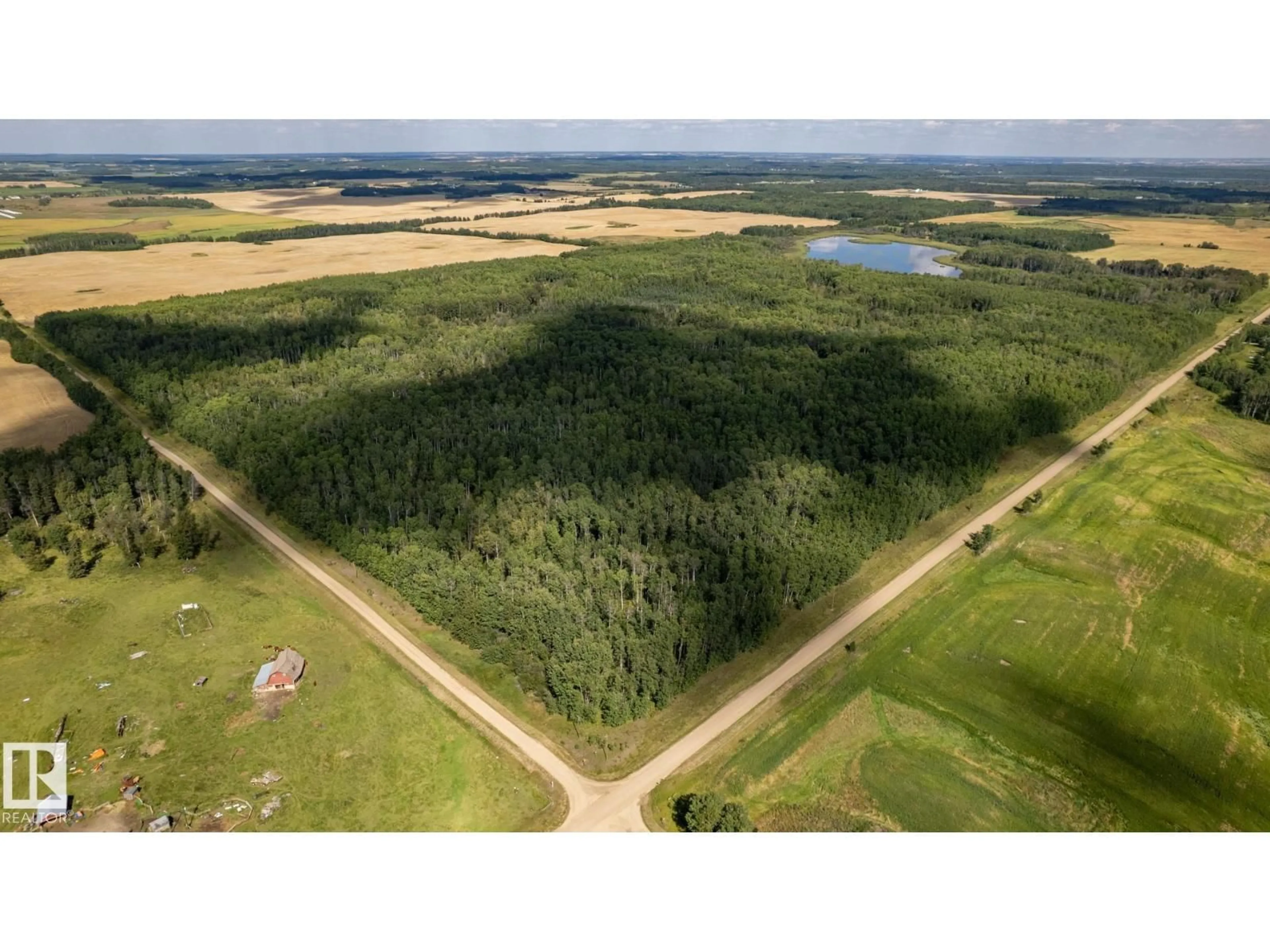 A pic from outside/outdoor area/front of a property/back of a property/a pic from drone, forest/trees view for 1420 TWP ROAD 554, Rural Lac Ste. Anne County Alberta T0E1V2