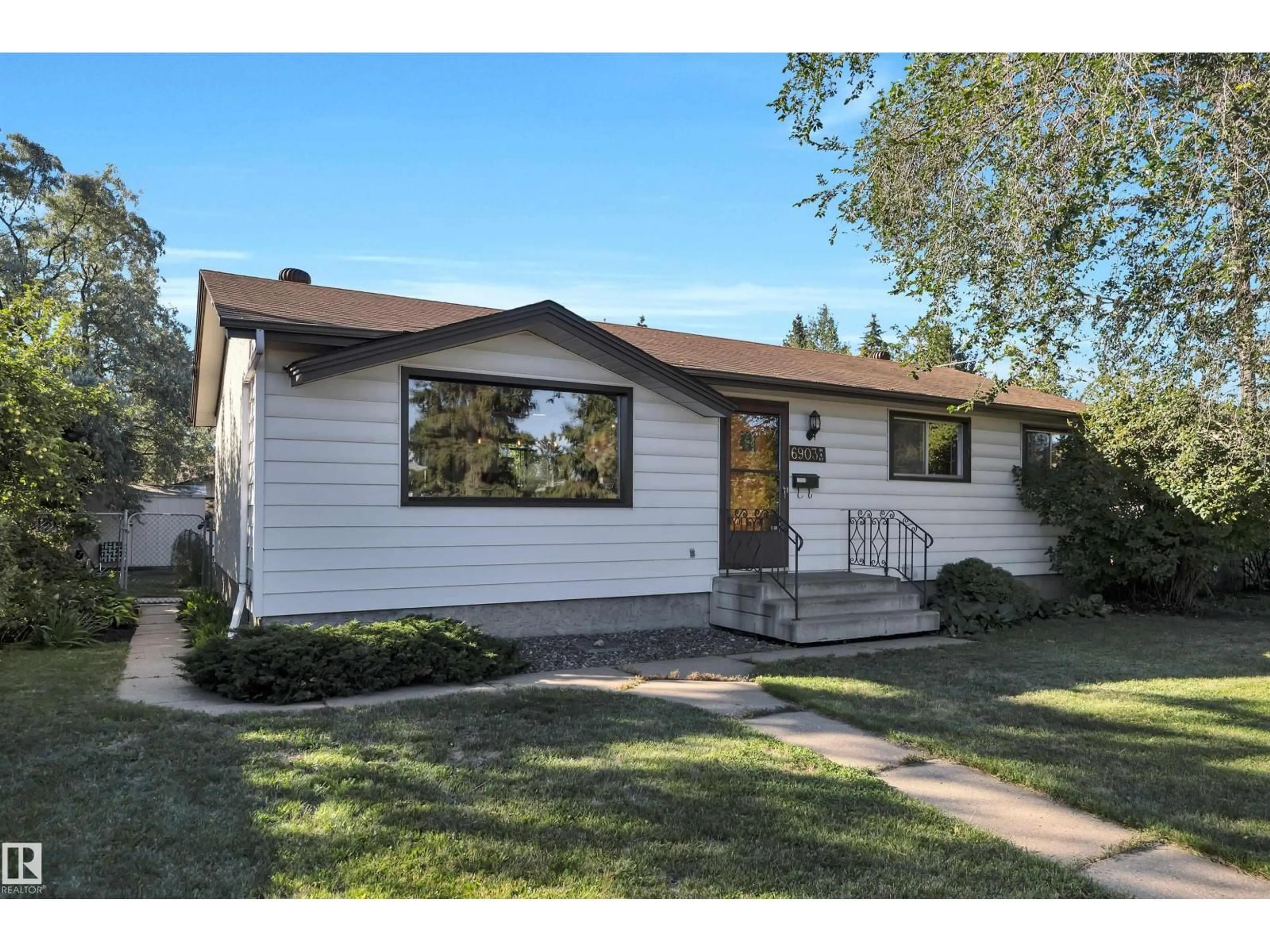 Home with vinyl exterior material, street for 6903 94B AV, Edmonton Alberta T6B0Z8