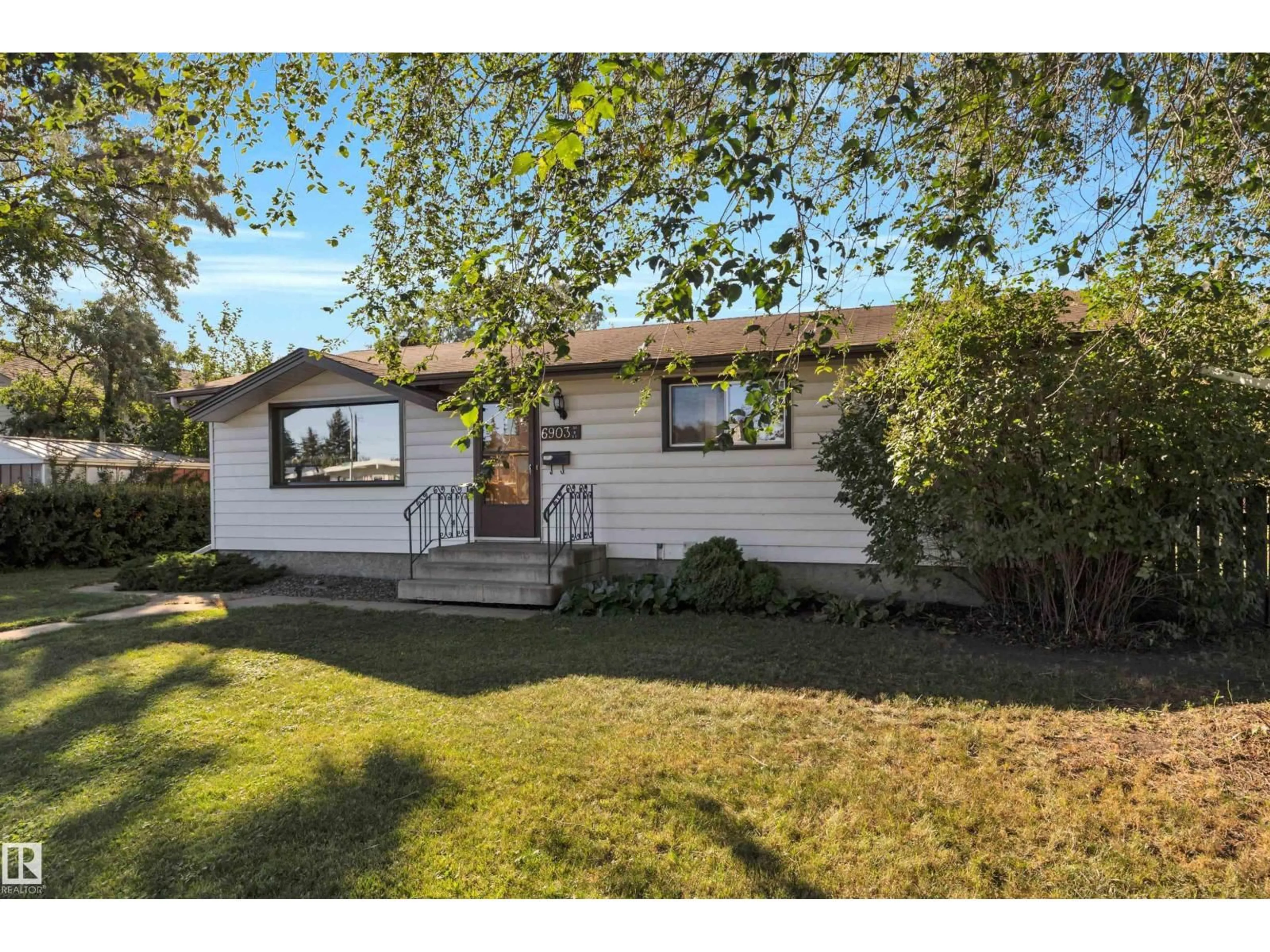Home with vinyl exterior material, street for 6903 94B AV, Edmonton Alberta T6B0Z8