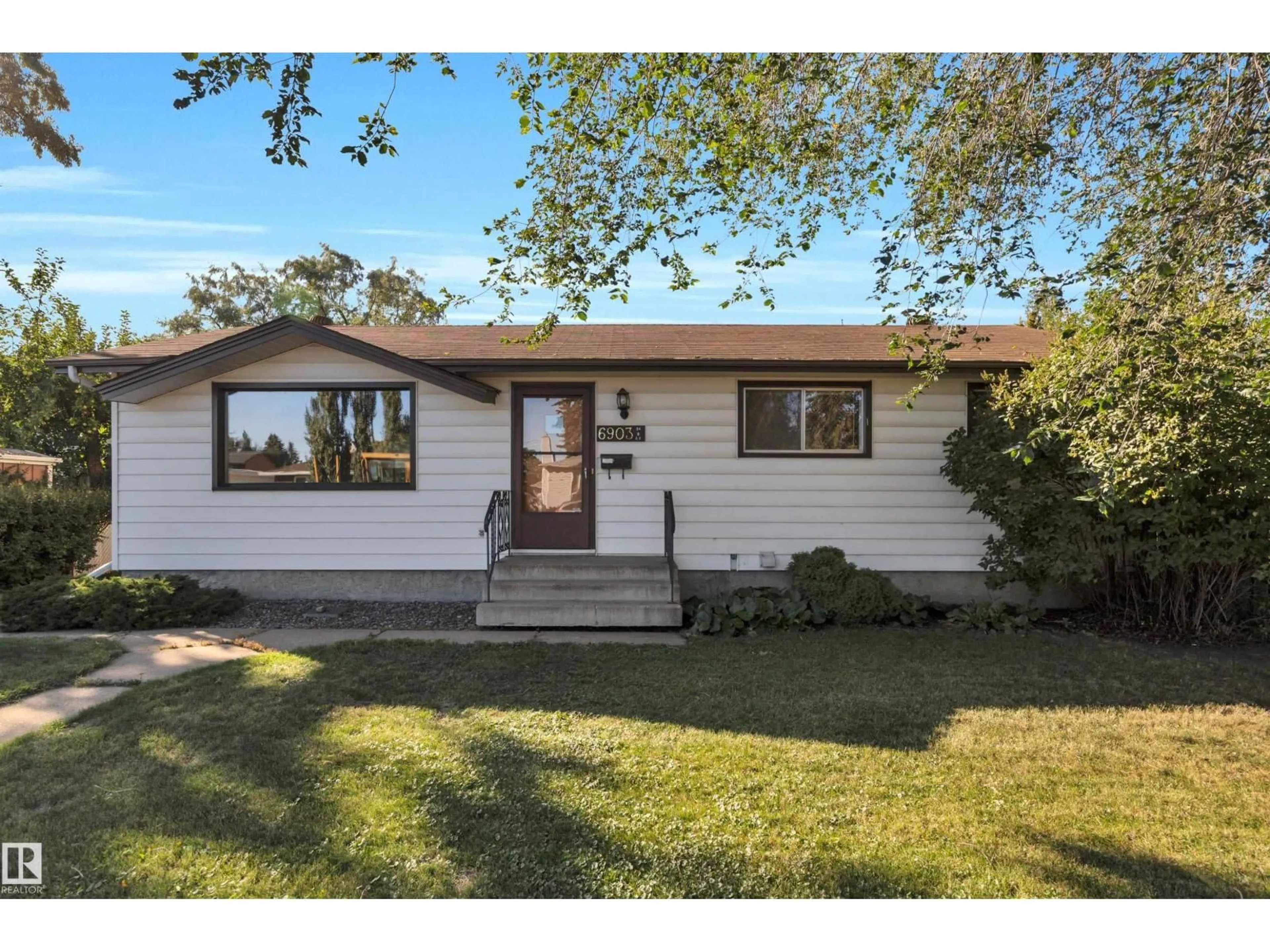 Home with vinyl exterior material, street for 6903 94B AV, Edmonton Alberta T6B0Z8