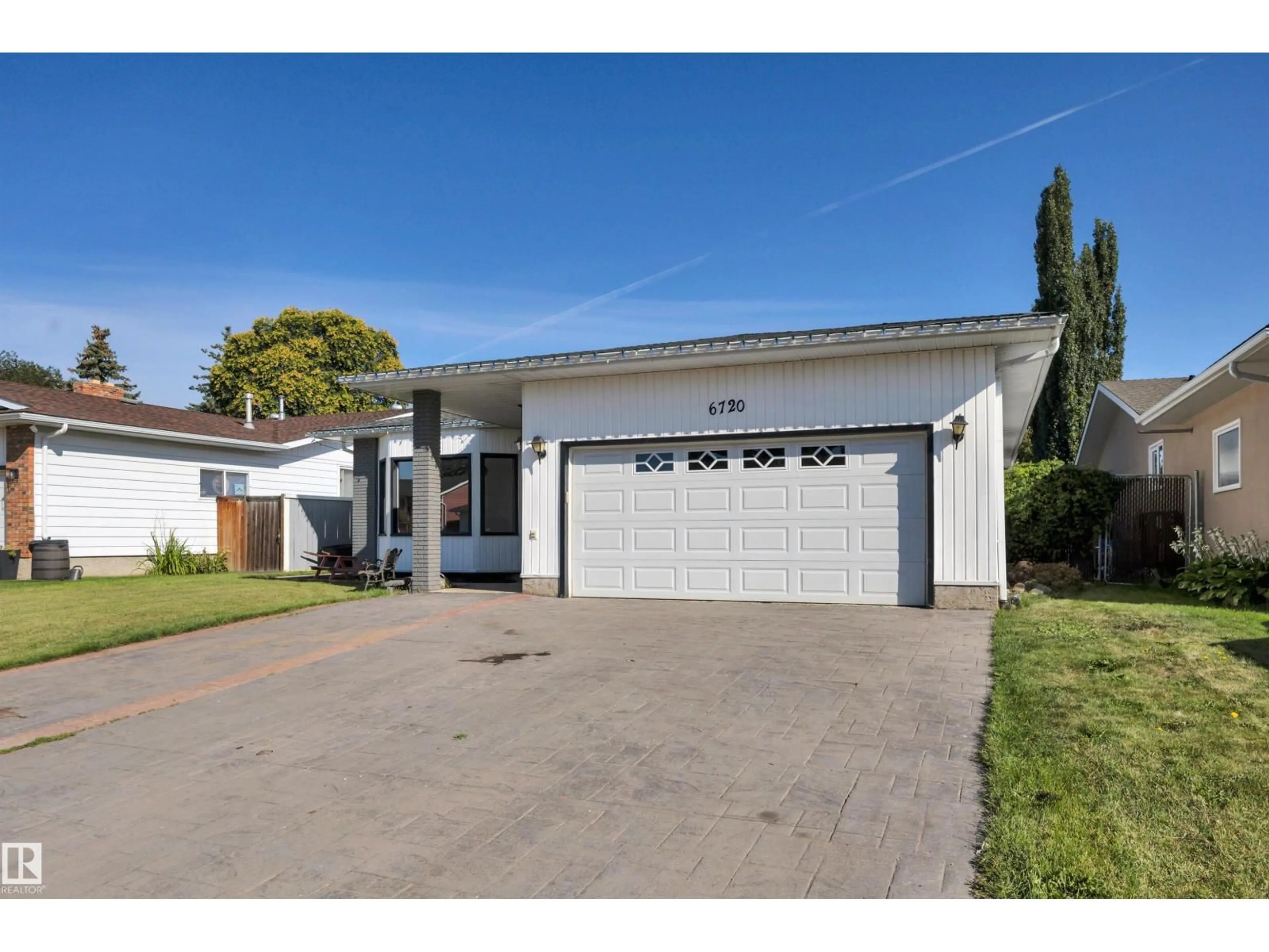 Home with vinyl exterior material, street for 6720 20 AV, Edmonton Alberta T6K2H2
