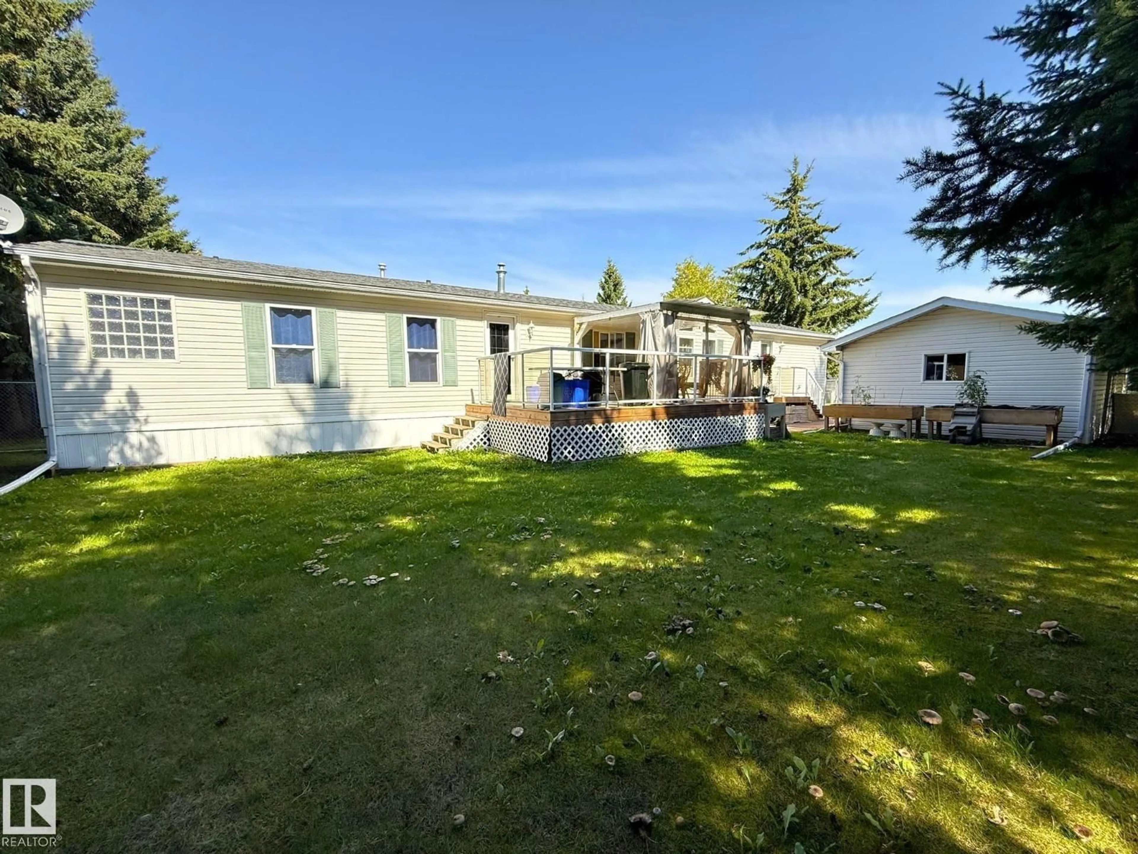 A pic from outside/outdoor area/front of a property/back of a property/a pic from drone, water/lake/river/ocean view for 10 VILLAGE GREEN MOBILE PARK, Warburg Alberta T0C2T0