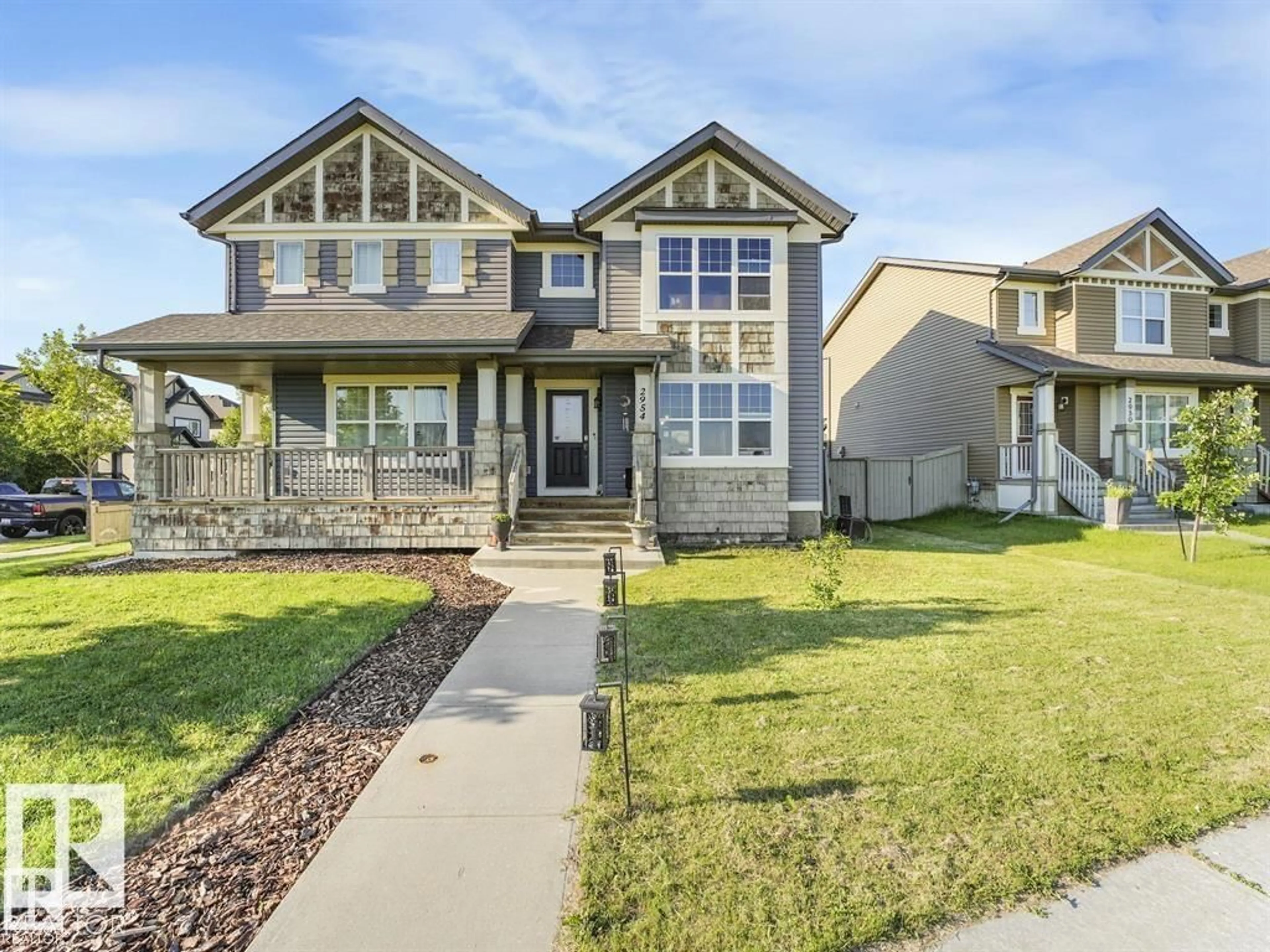 Home with vinyl exterior material, street for 2954 18A AV, Edmonton Alberta T6T0N7