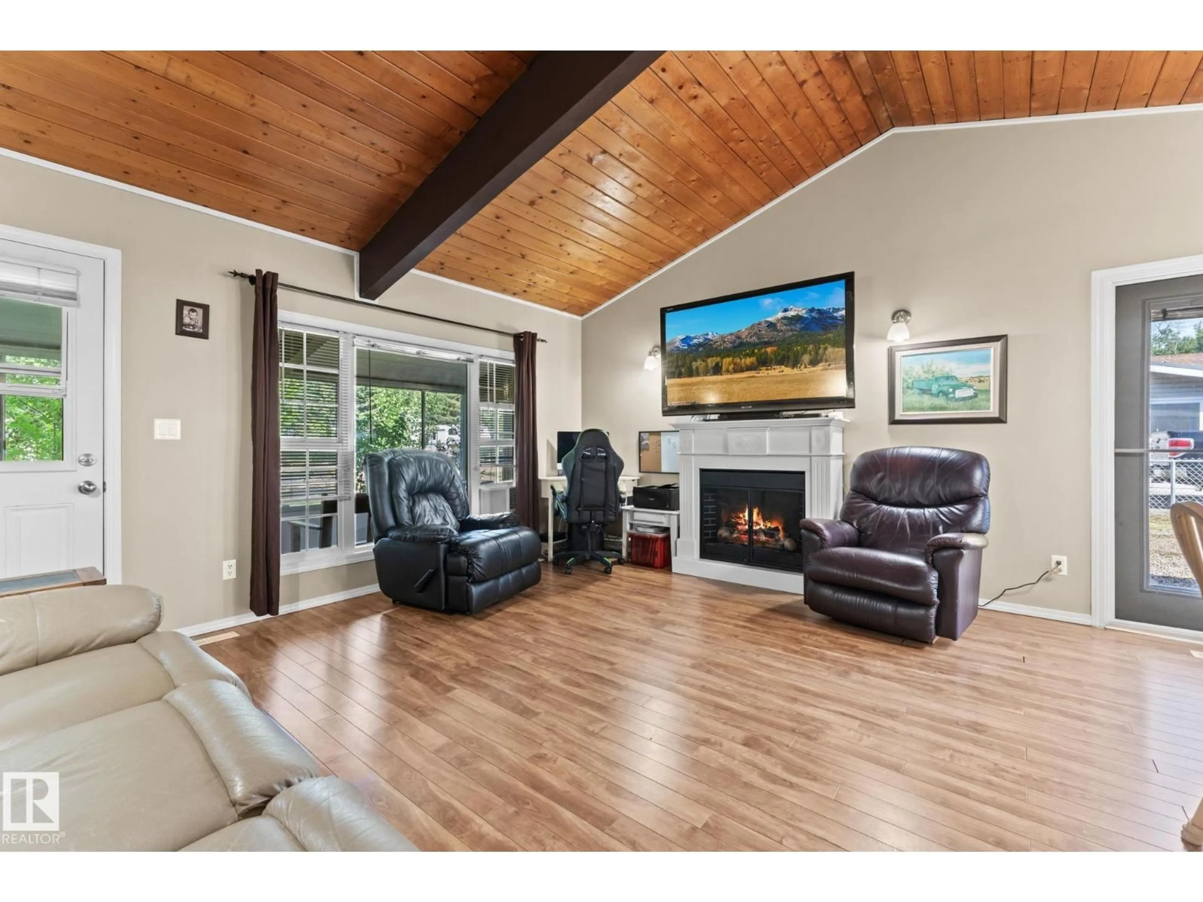 Living room with furniture, wood/laminate floor for 26 RGE ROAD 212 A, Rural Strathcona County Alberta T8G1B2