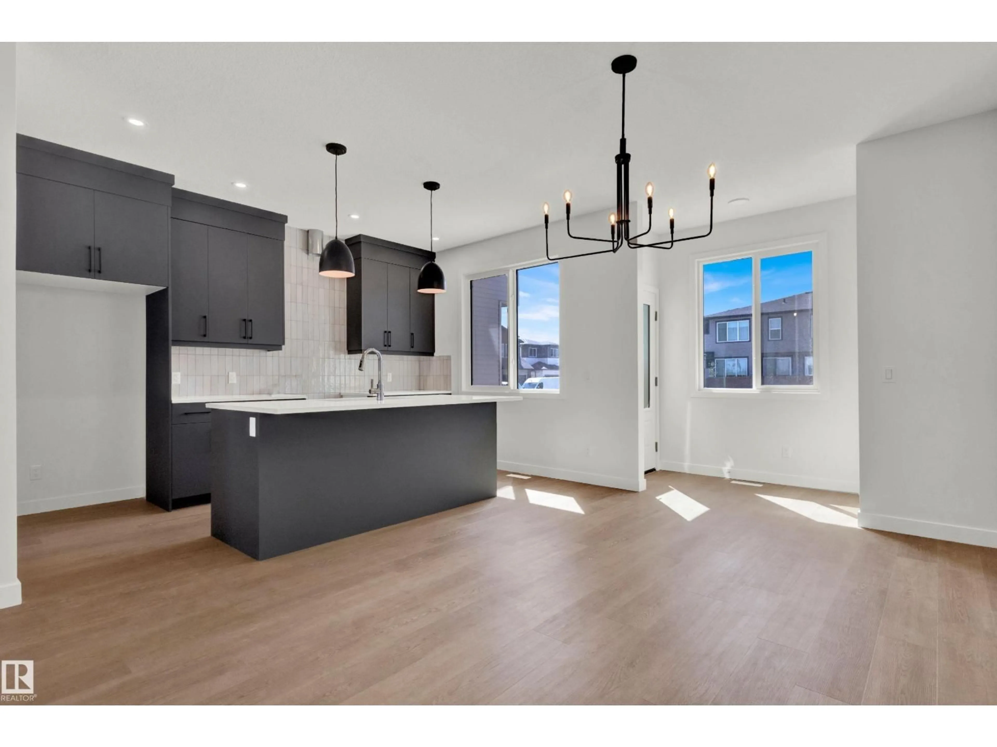 Open concept kitchen, wood/laminate floor for 507 PATERSON WY, Edmonton Alberta T6W5V2