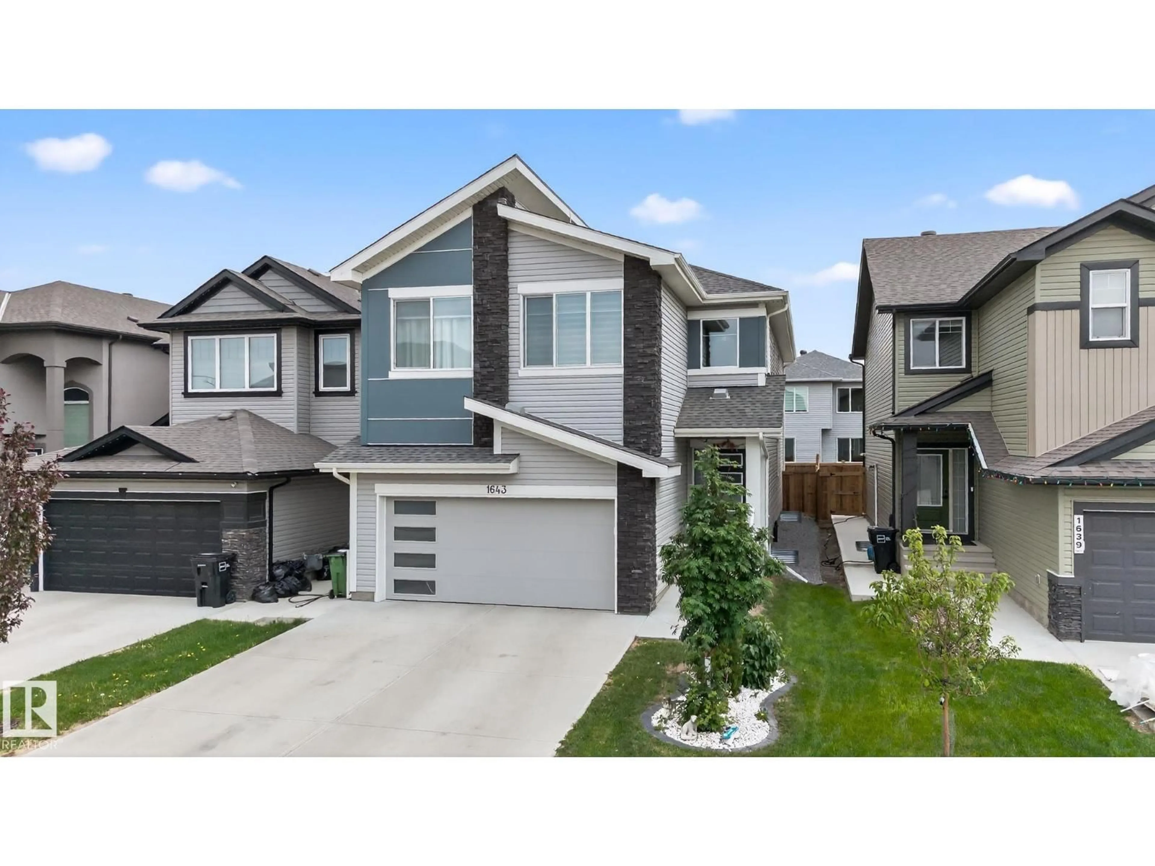 Home with vinyl exterior material, street for 1643 14 ST, Edmonton Alberta T6T2N6