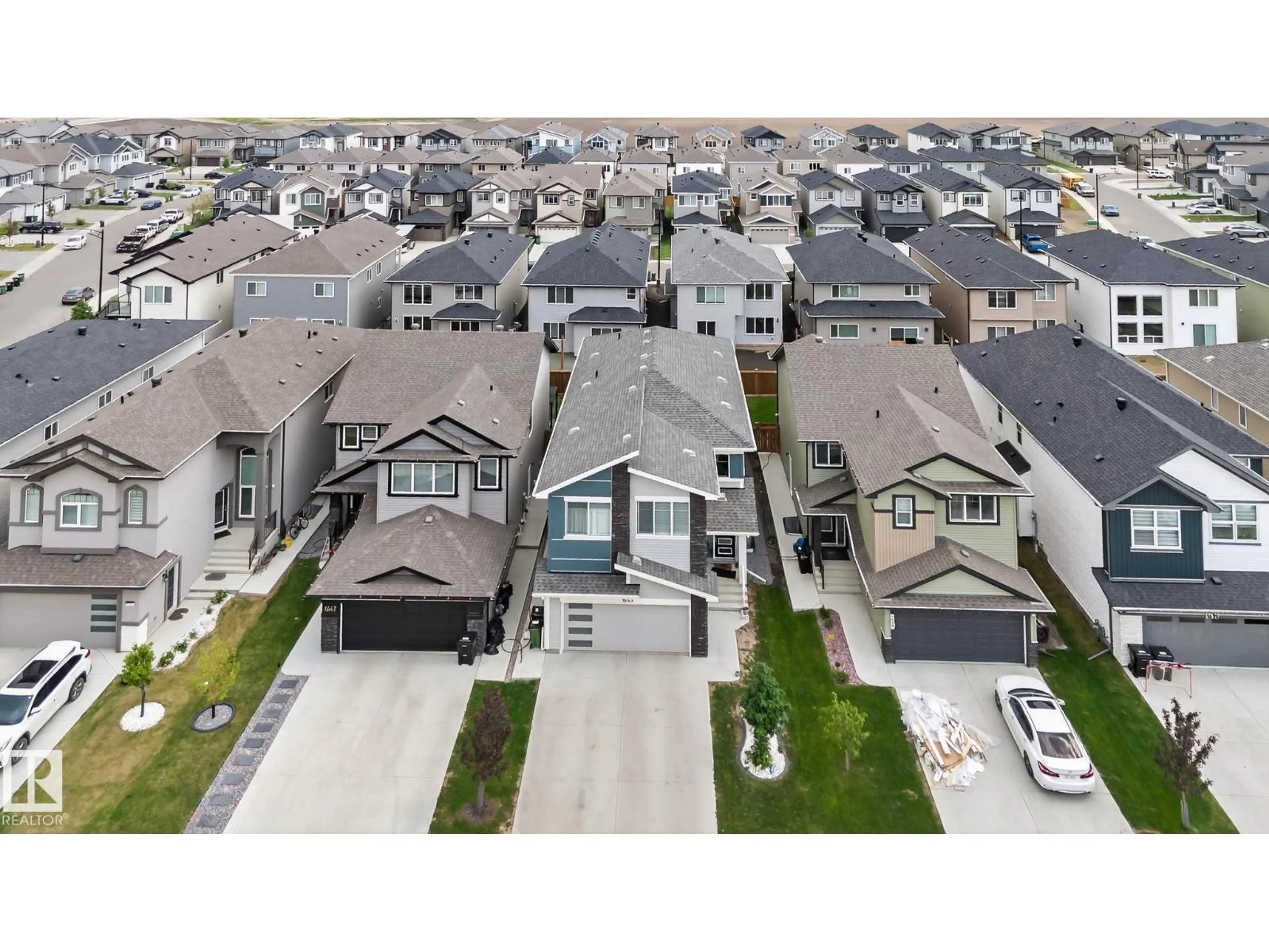 A pic from outside/outdoor area/front of a property/back of a property/a pic from drone, street for 1643 14 ST, Edmonton Alberta T6T2N6