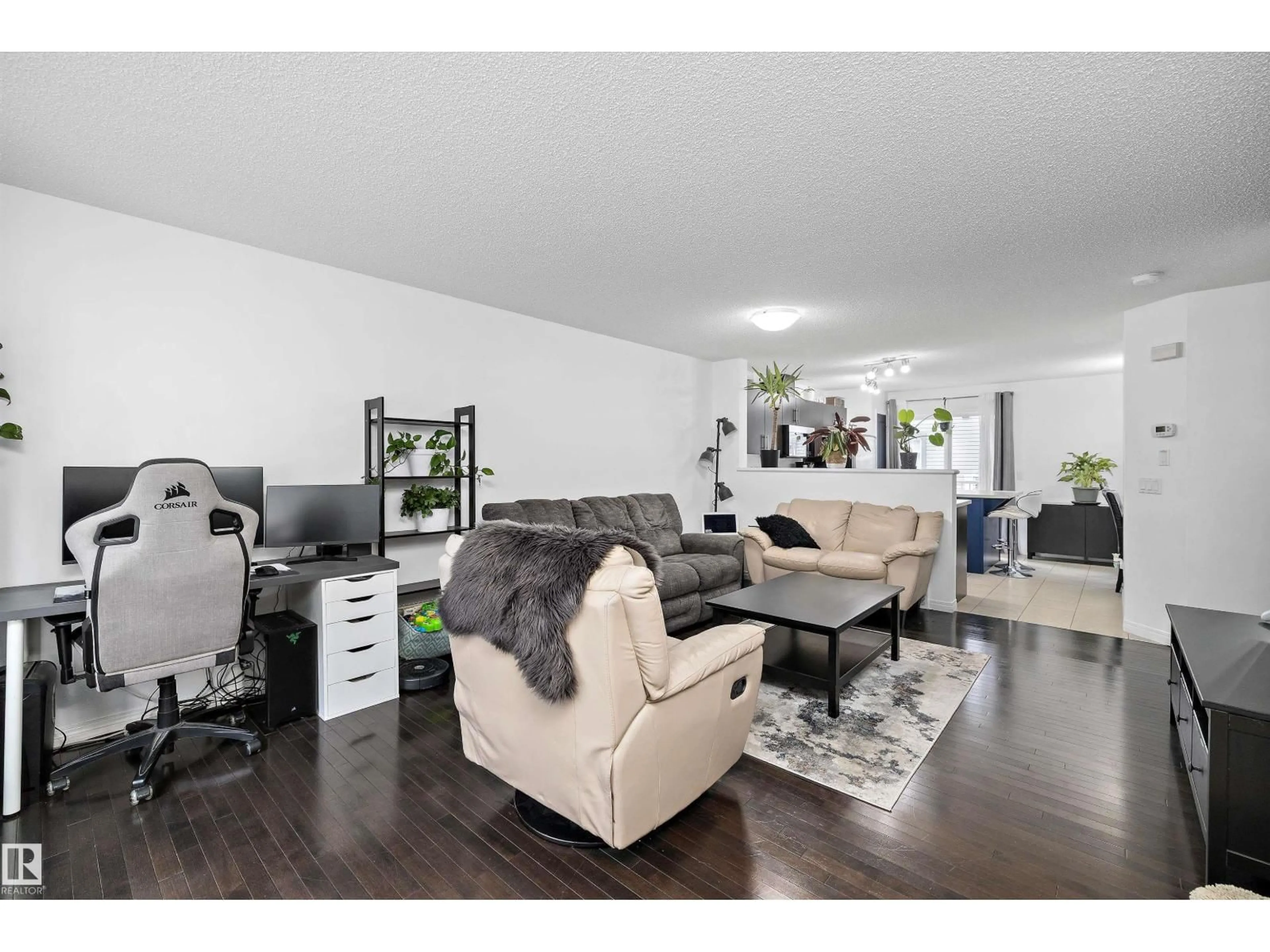 Living room with furniture, wood/laminate floor for 465 - 16 HEMINGWAY RD, Edmonton Alberta T6M0J7