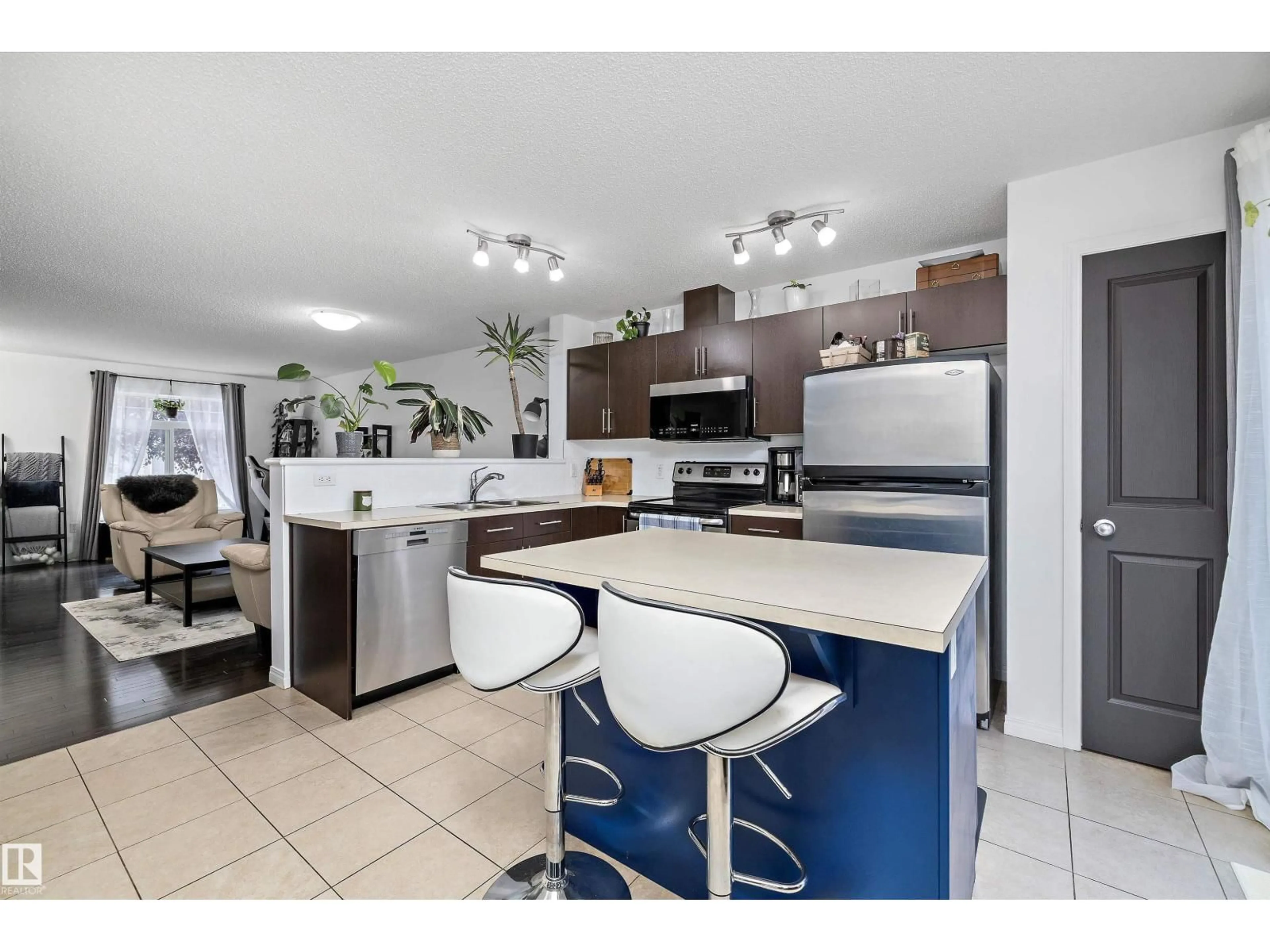 Open concept kitchen, ceramic/tile floor for 465 - 16 HEMINGWAY RD, Edmonton Alberta T6M0J7