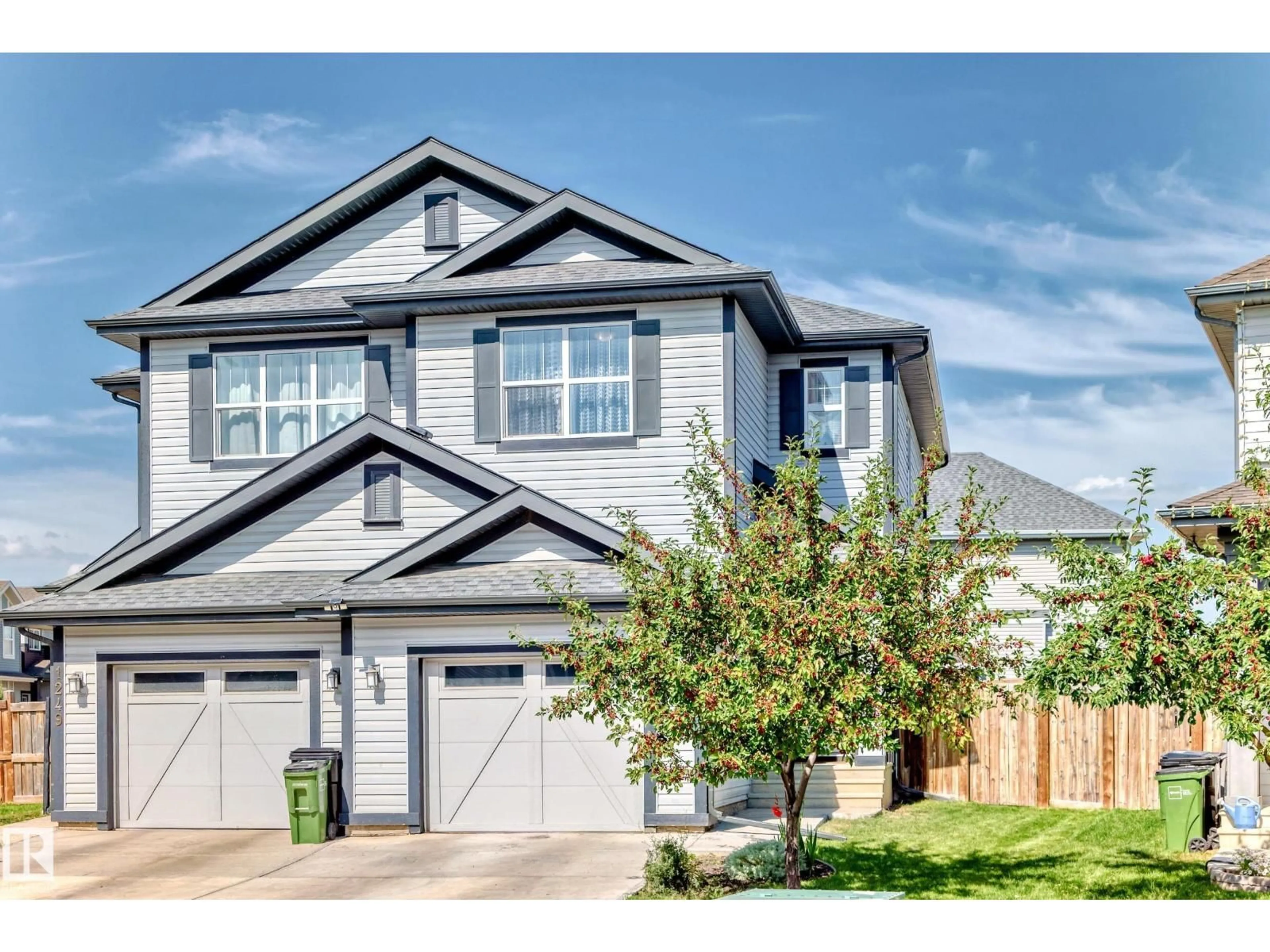 Home with vinyl exterior material, street for 1247 MCCONACHIE BV, Edmonton Alberta T5Y3T3