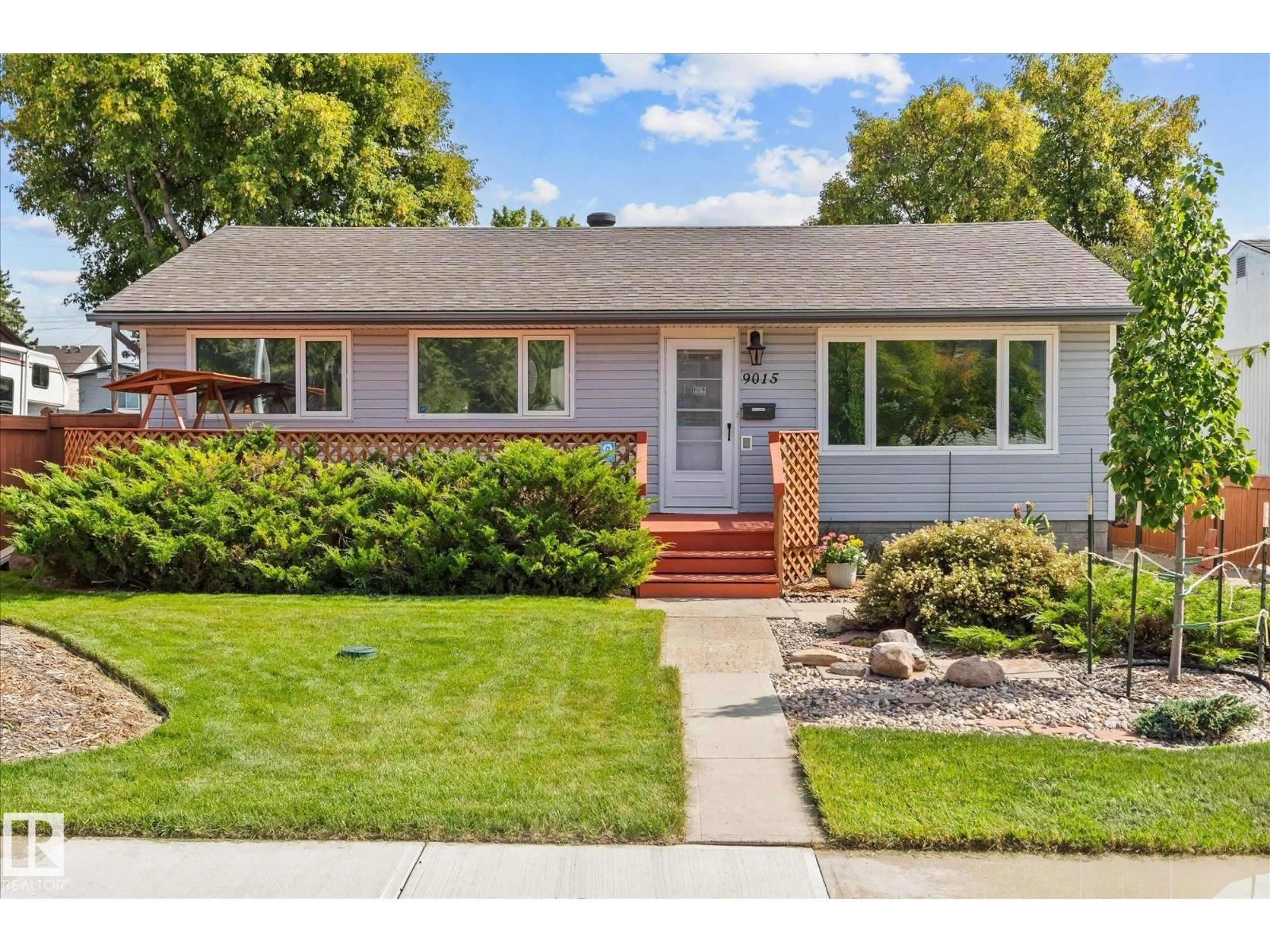 Home with vinyl exterior material, street for 9015 151 ST, Edmonton Alberta T5R1J4