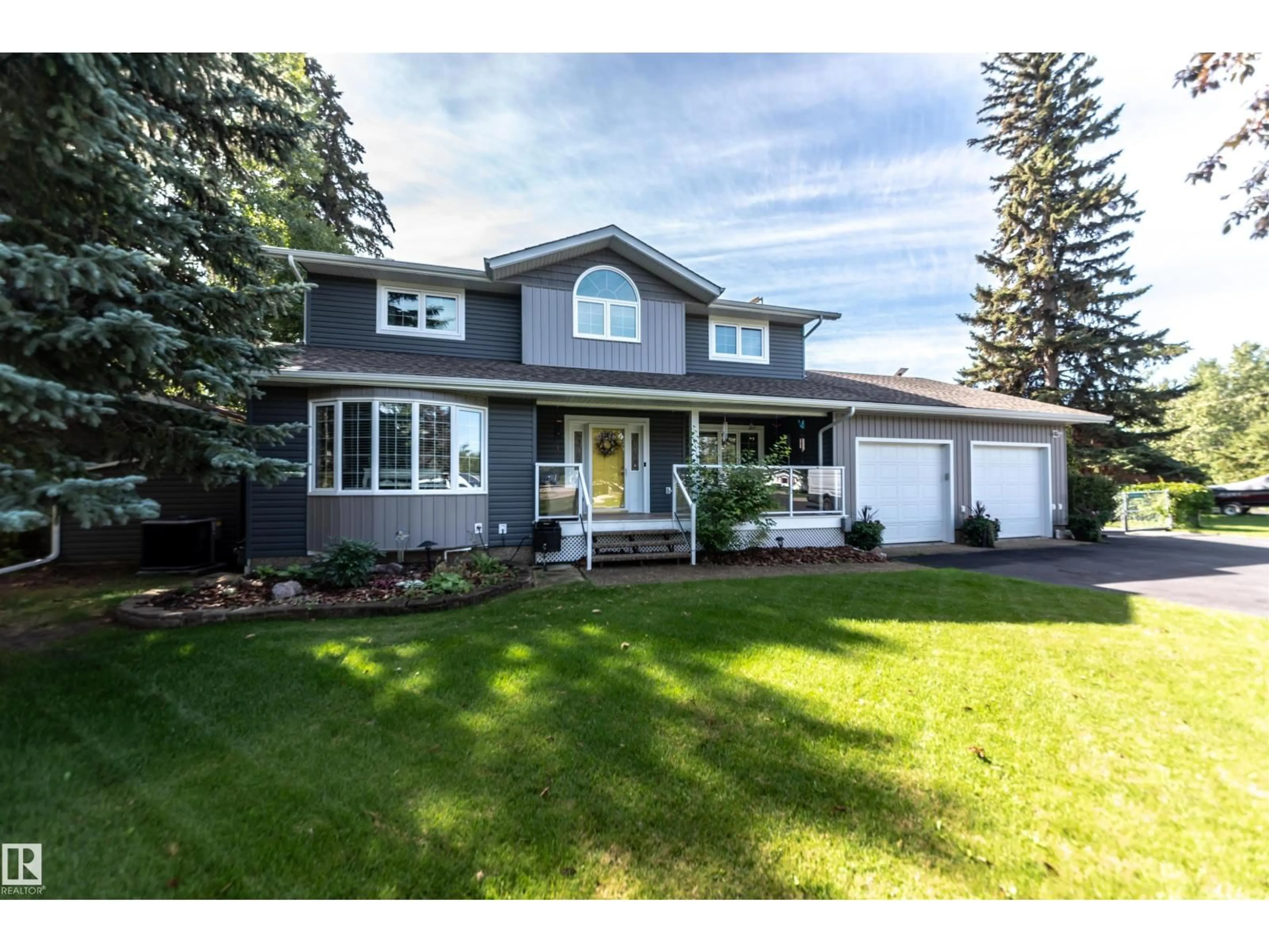 Home with vinyl exterior material, street for 4811 49A AV, Rural Lac Ste. Anne County Alberta T0E0E0
