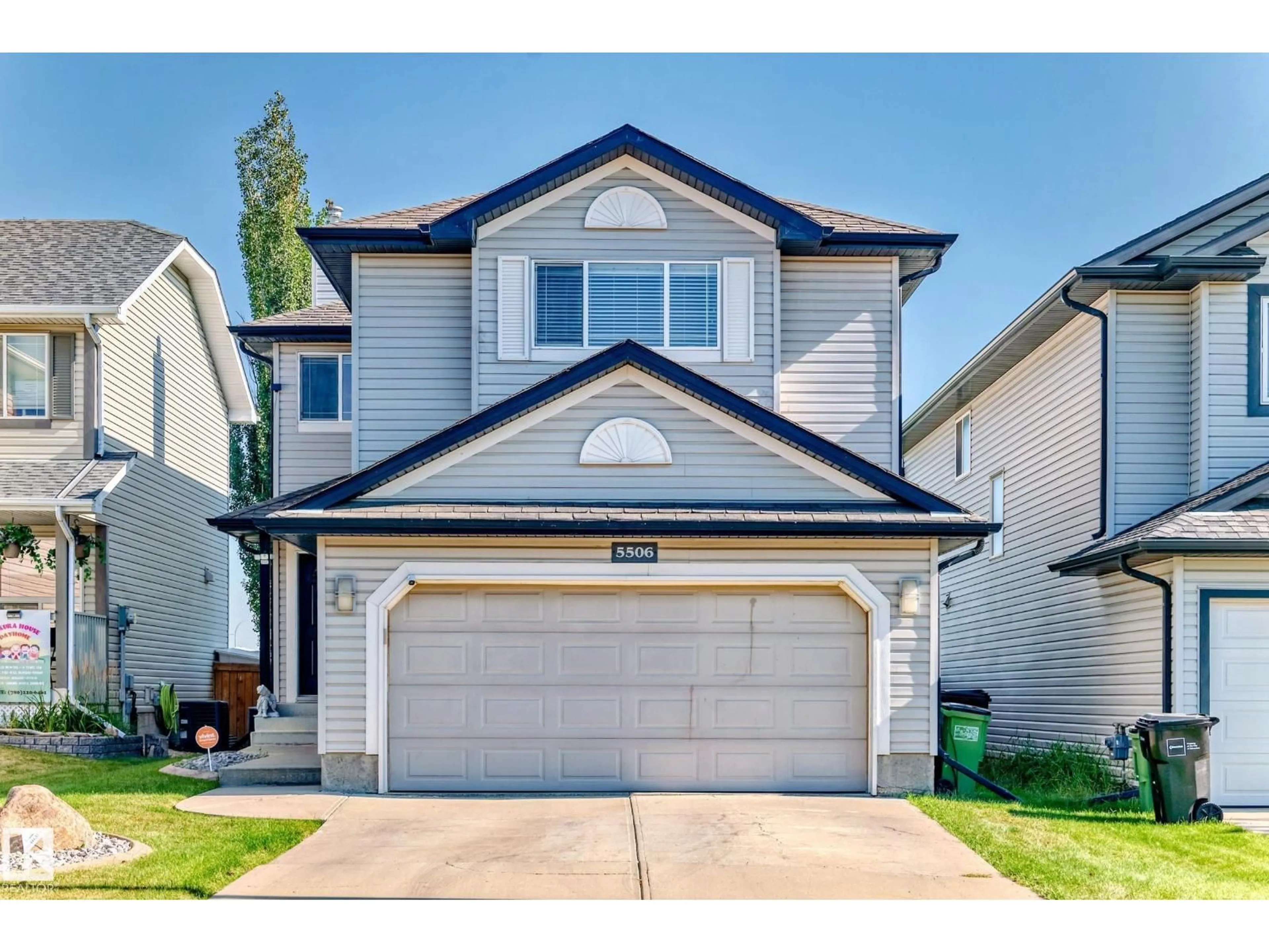 Home with vinyl exterior material, street for NW - 5506 165 AV, Edmonton Alberta T5Y3K8