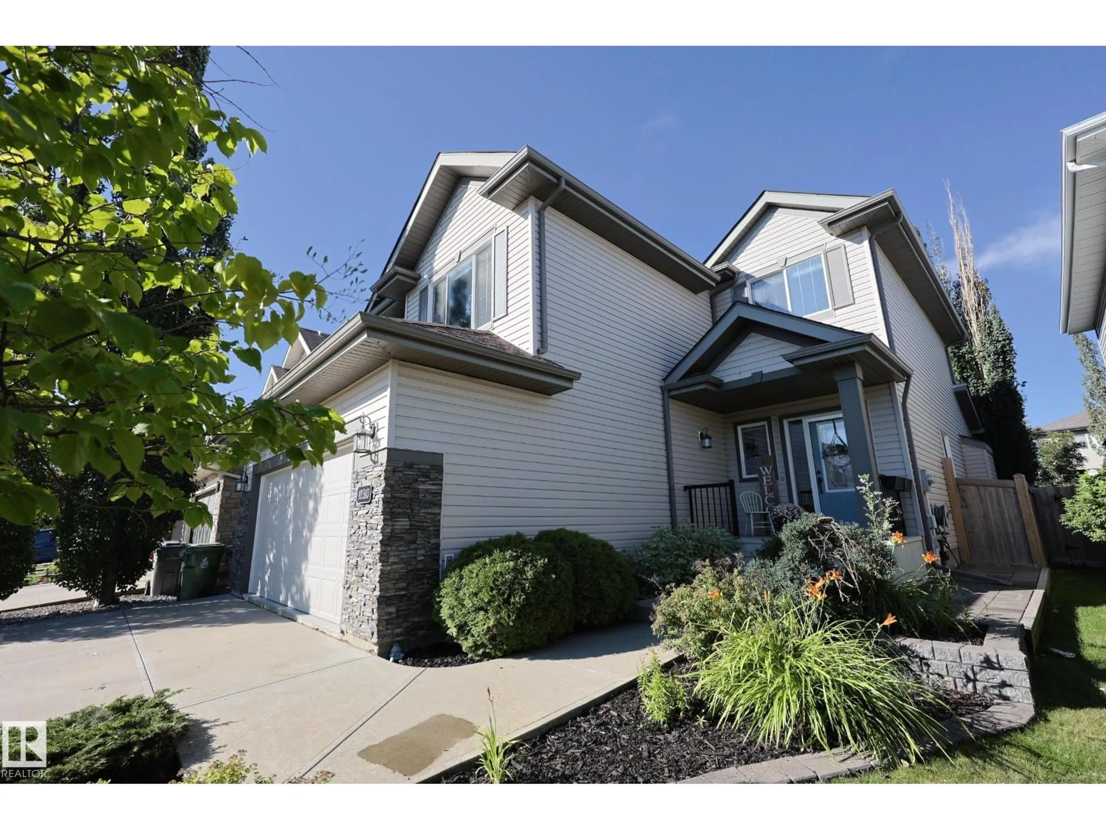Home with vinyl exterior material, street for 10310 96 ST, Morinville Alberta T8R0B4