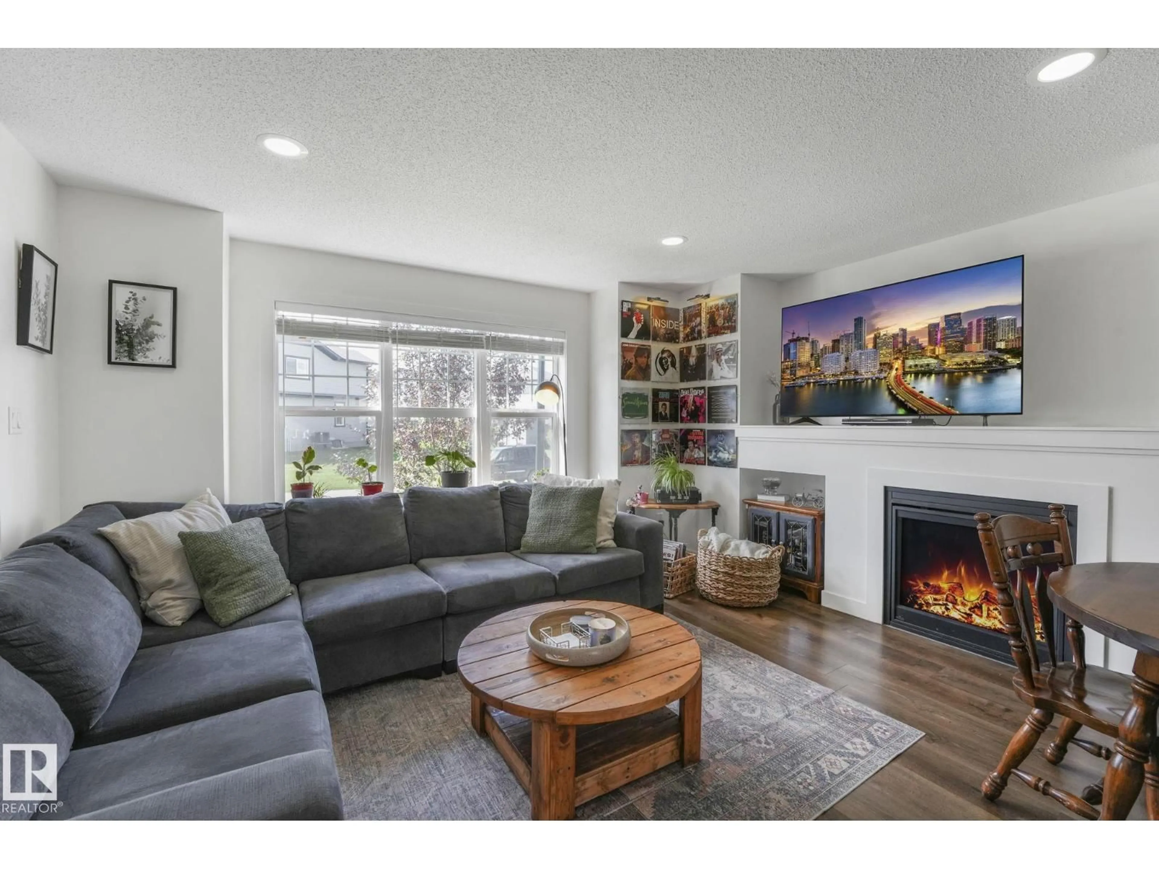 Living room with furniture, wood/laminate floor for 28 HOPE CM, Spruce Grove Alberta T7X0X3