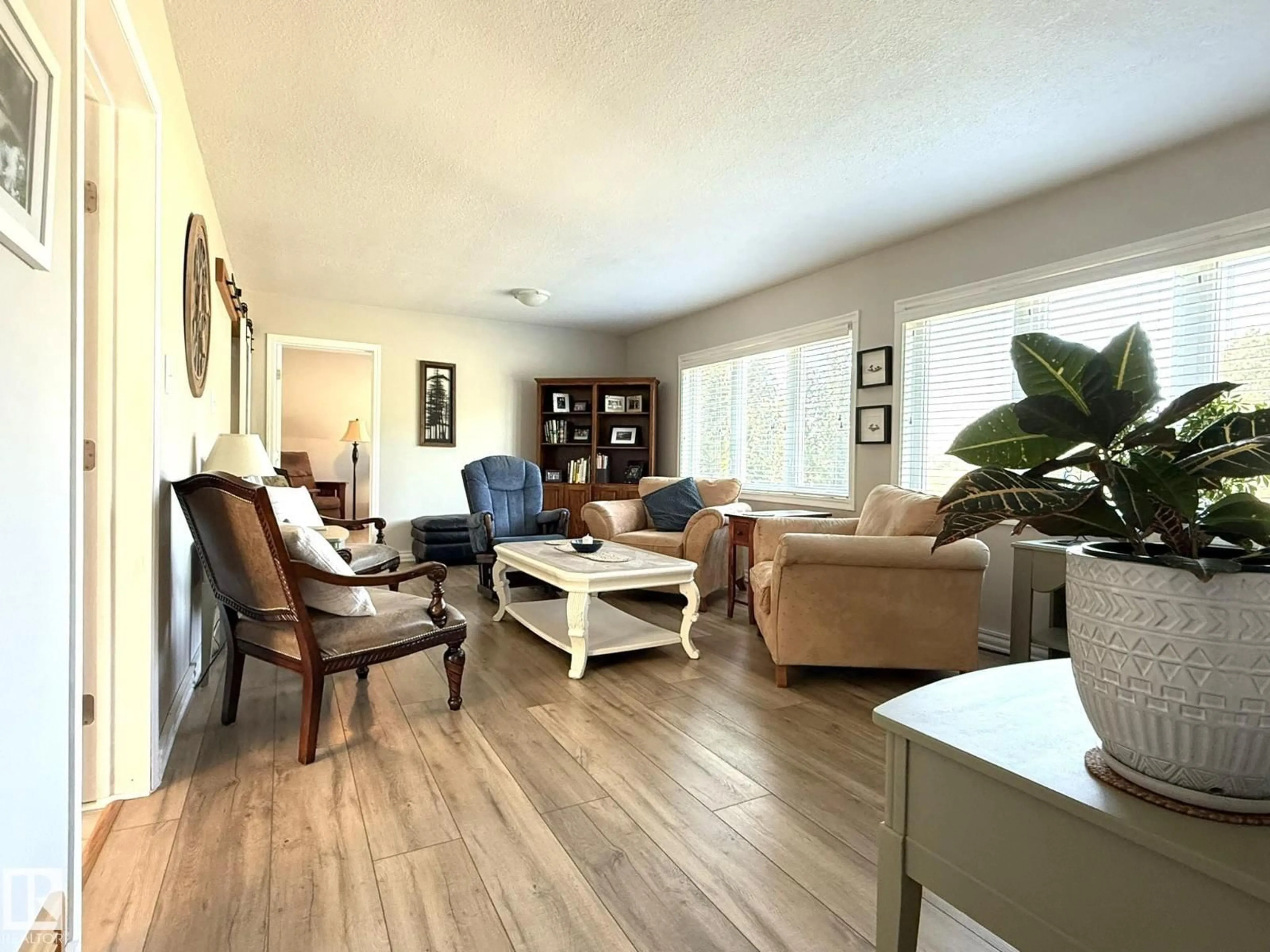 Living room with furniture, wood/laminate floor for 5232 52 AV, Warburg Alberta T0C2T0