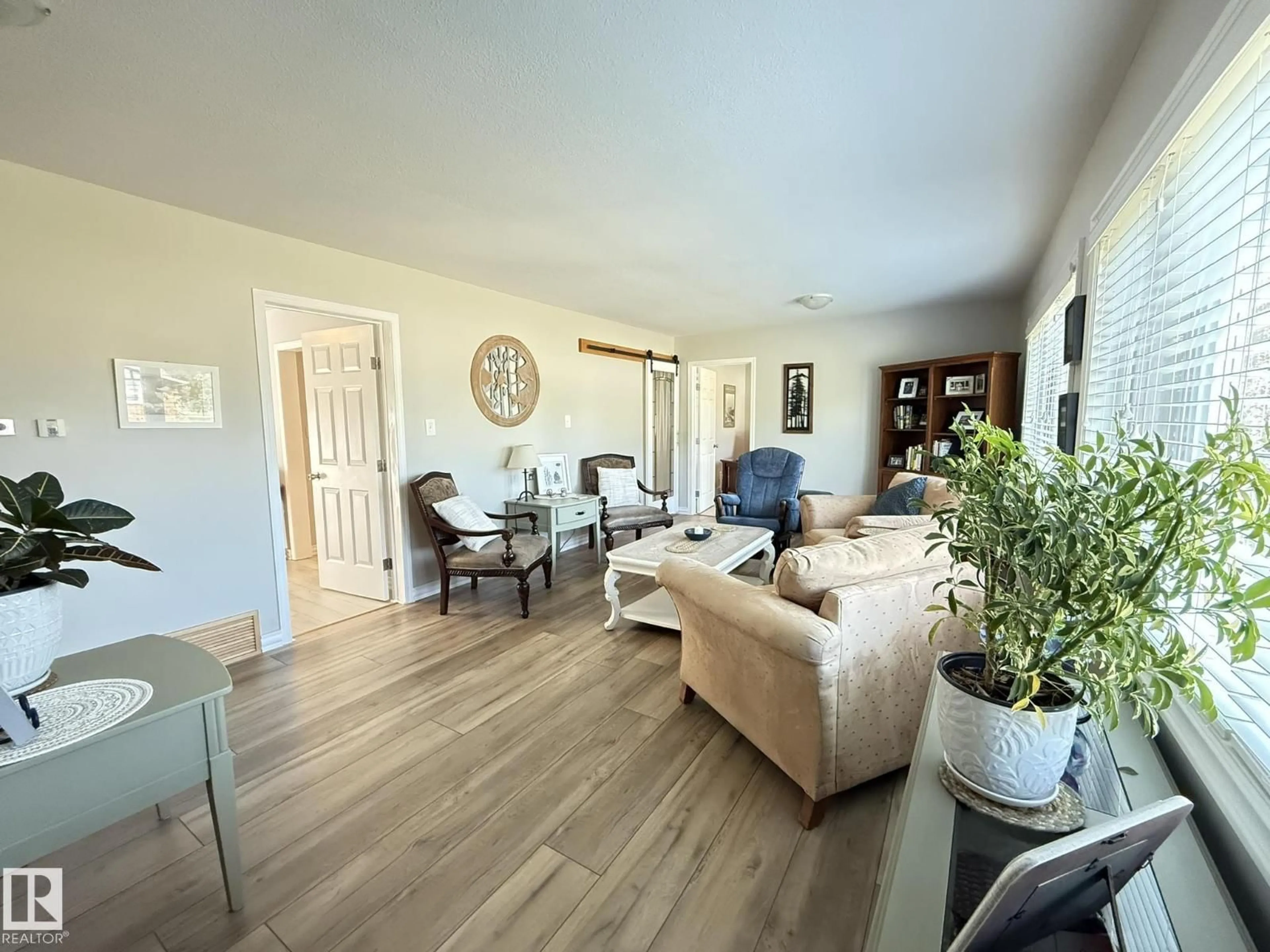 Living room with furniture, wood/laminate floor for 5232 52 AV, Warburg Alberta T0C2T0