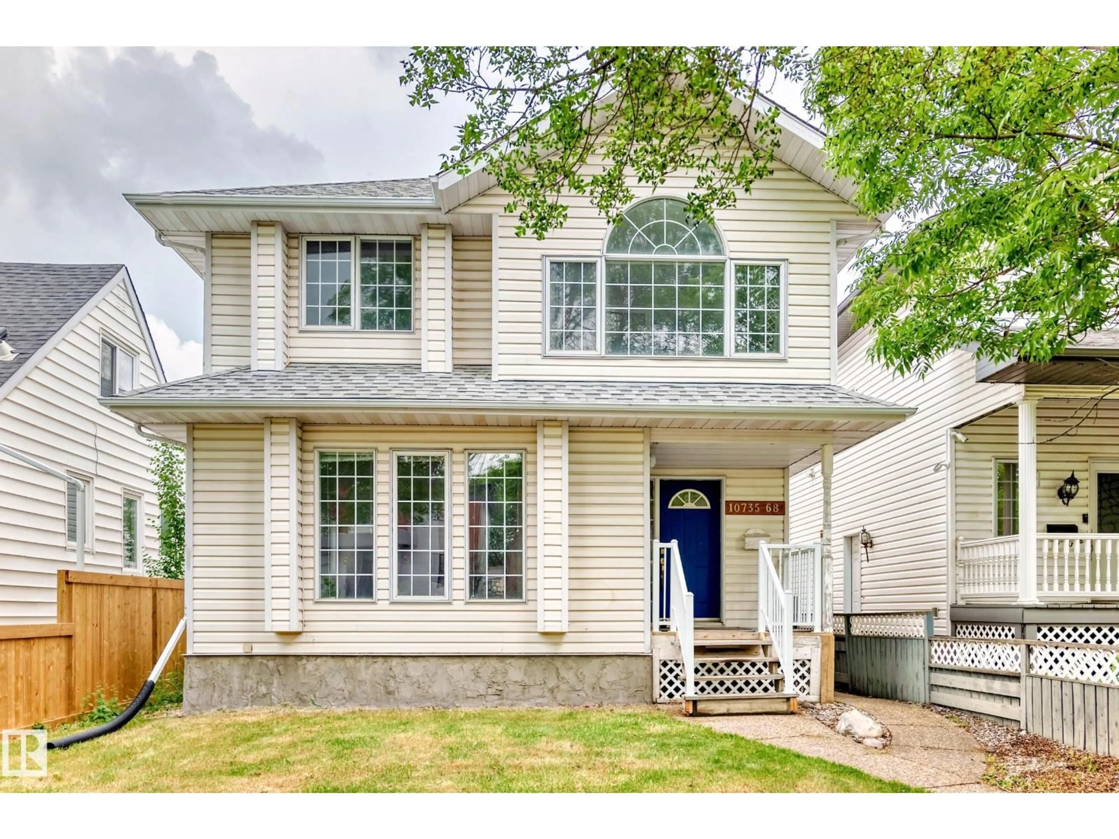 Home with vinyl exterior material, street for 10735 68 AV, Edmonton Alberta T6H2B6