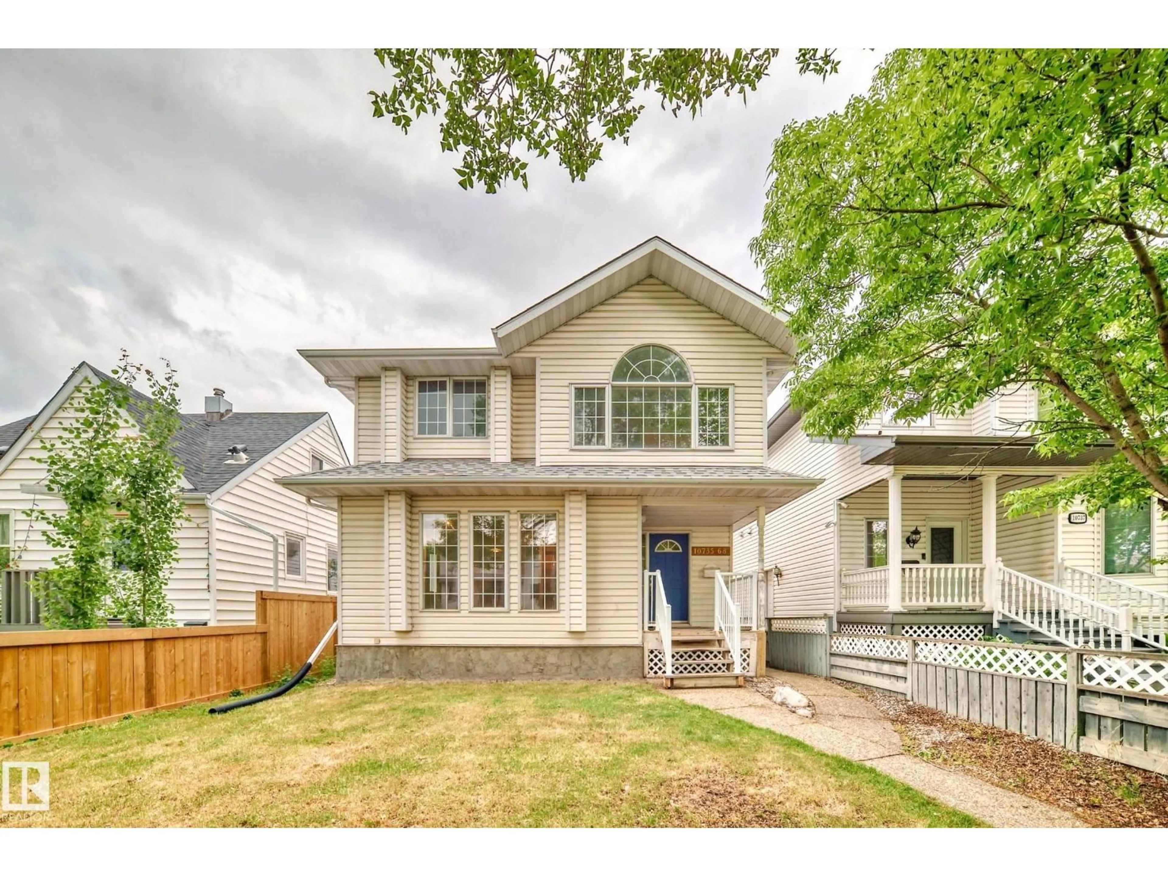 Home with vinyl exterior material, street for 10735 68 AV, Edmonton Alberta T6H2B6