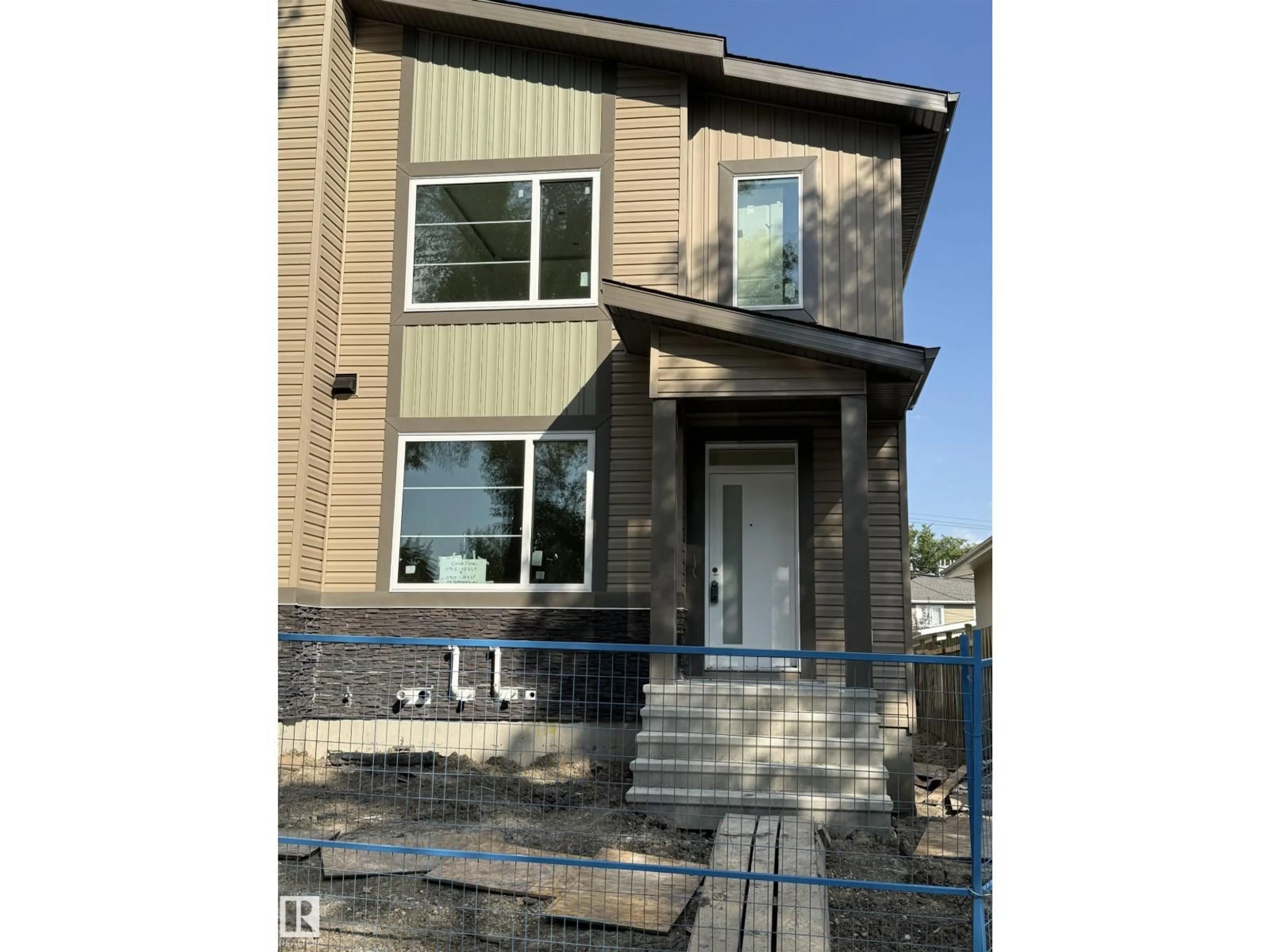 Home with vinyl exterior material, street for NW - 11915 123 ST, Edmonton Alberta T5L0G9