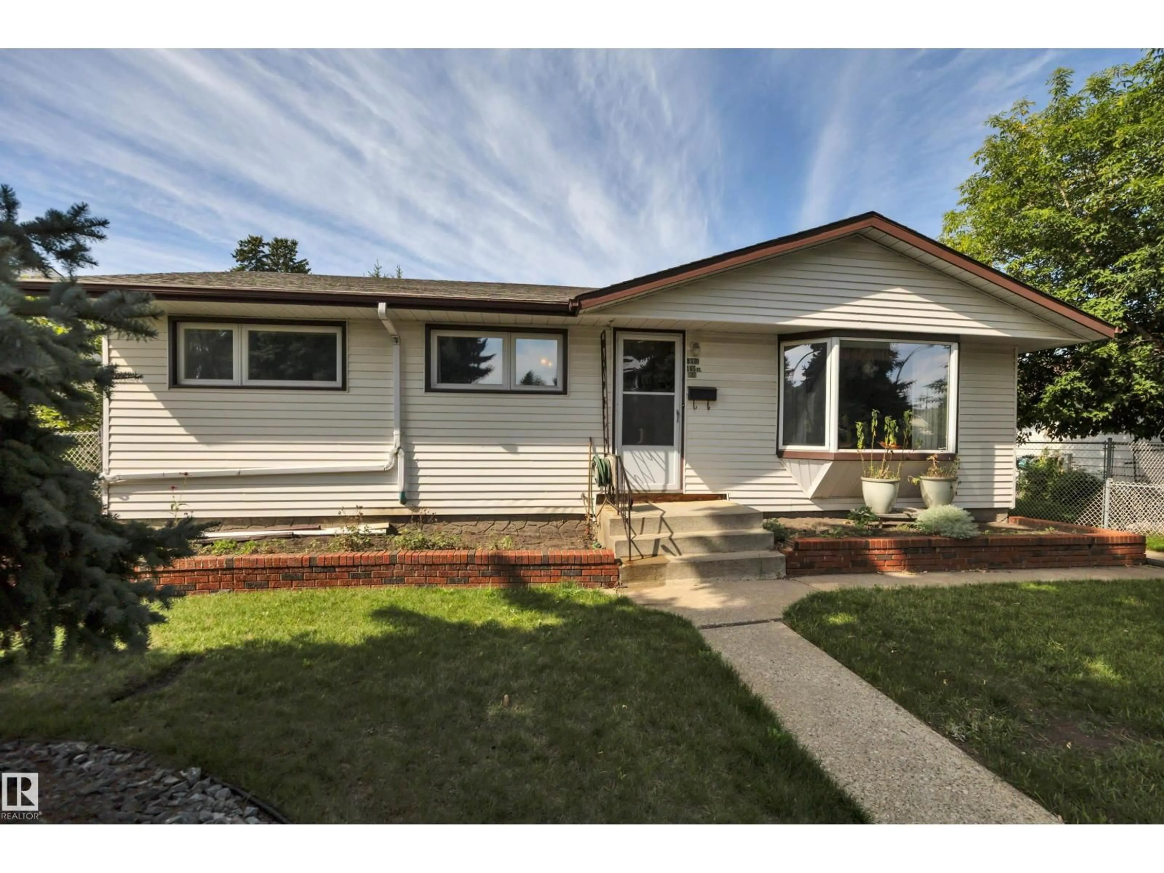 Home with vinyl exterior material, street for 8330 165 ST, Edmonton Alberta T5R2R4