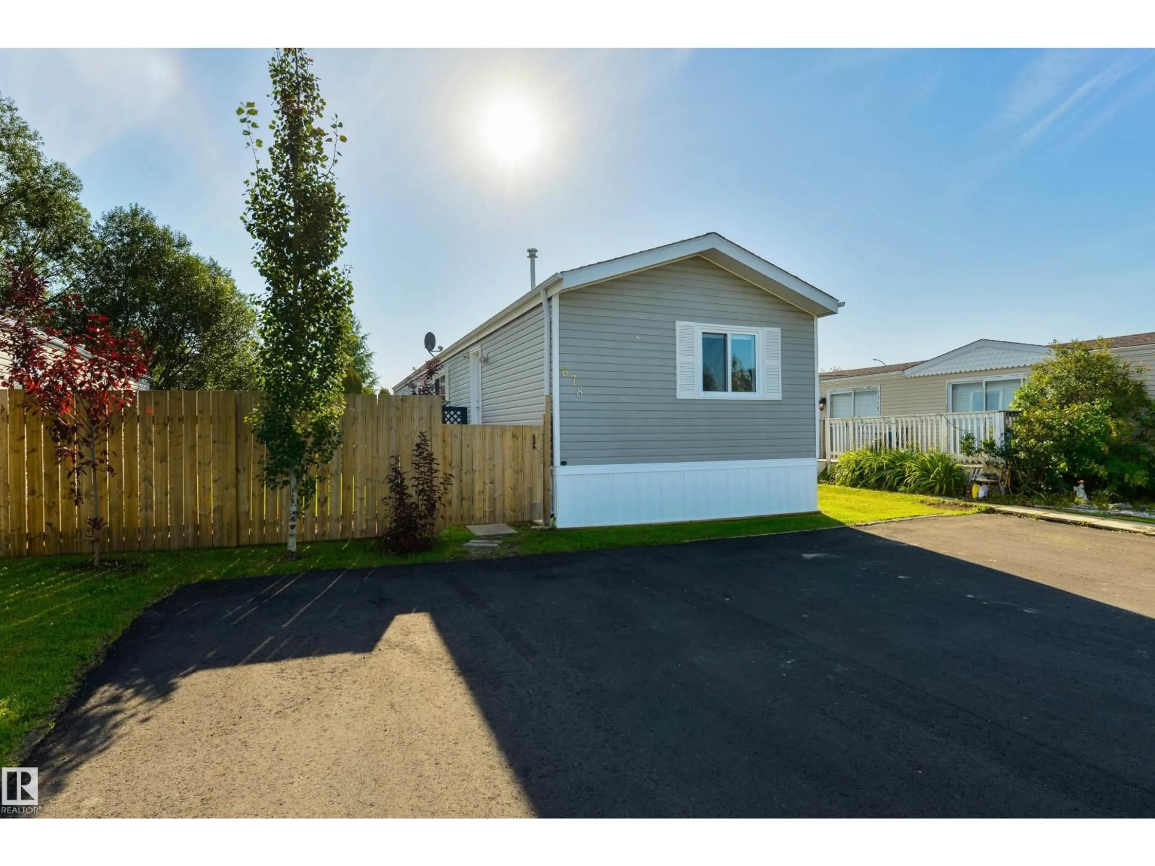Home with vinyl exterior material, street for 678 53222 RGE RD 272, Rural Parkland County Alberta T7X3P8