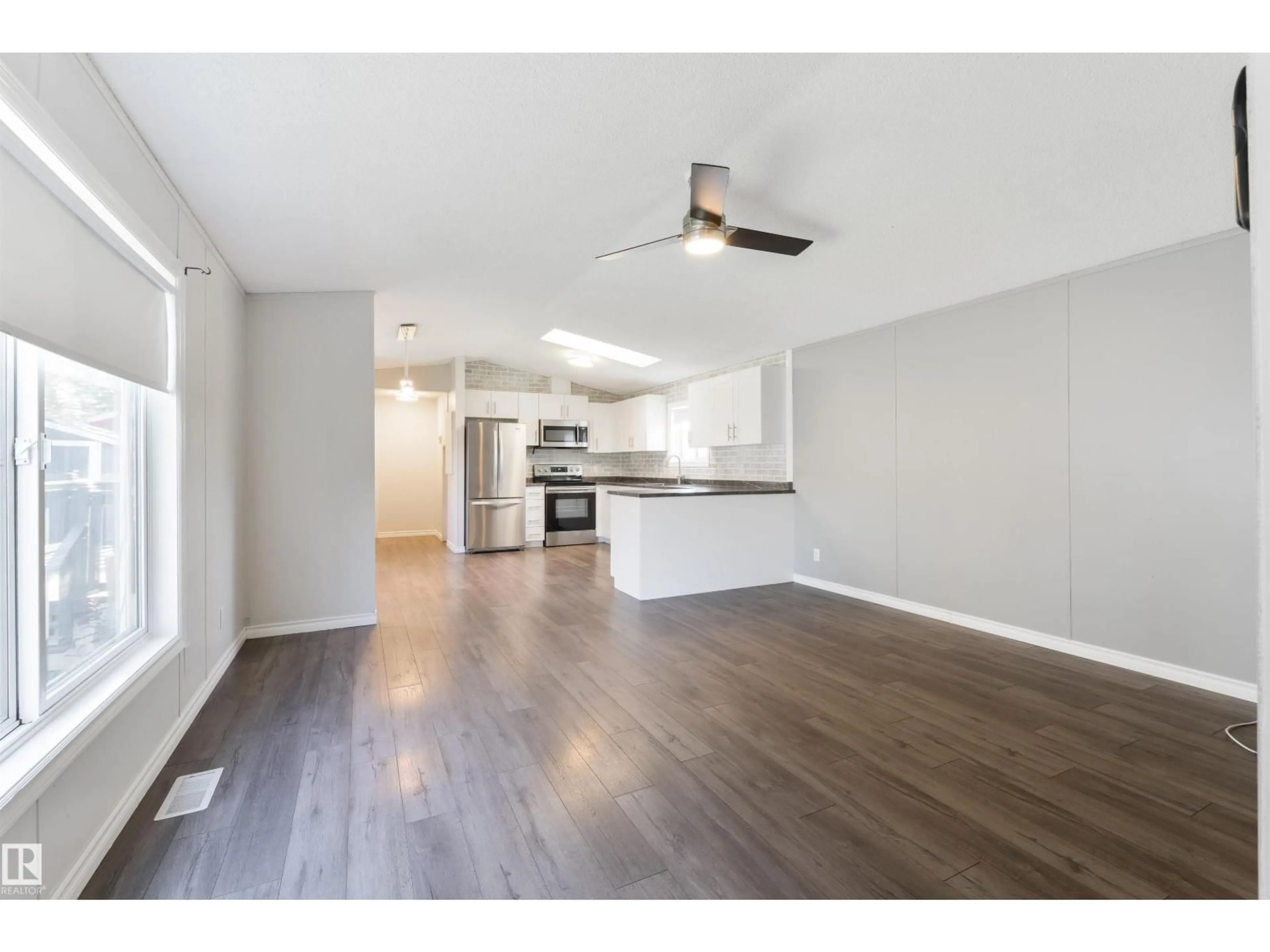 Open concept kitchen, wood/laminate floor for 678 53222 RGE RD 272, Rural Parkland County Alberta T7X3P8