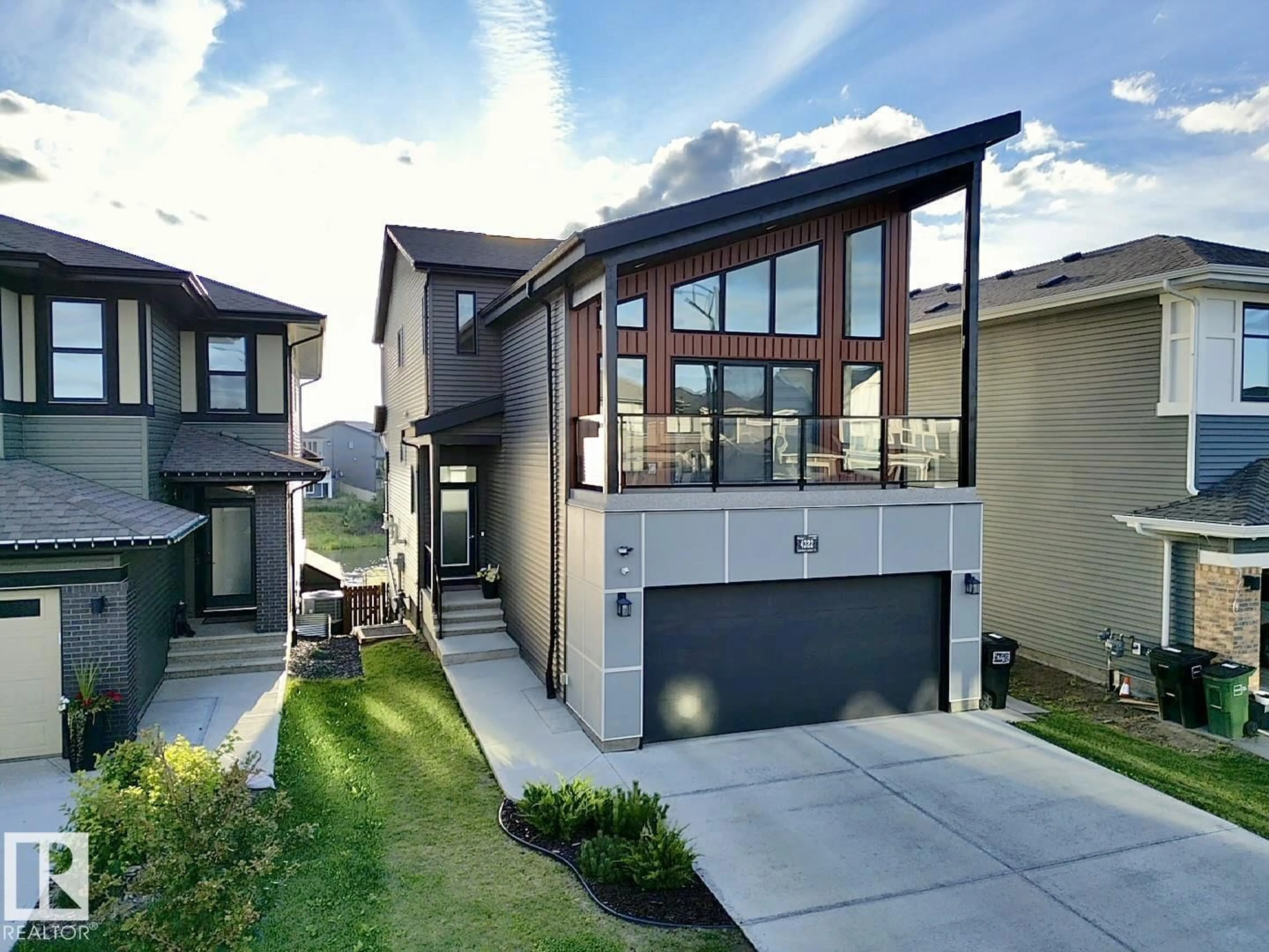 Home with brick exterior material, street for SW - 4322 HAWTHORN LANDING LD, Edmonton Alberta T6X2Y9