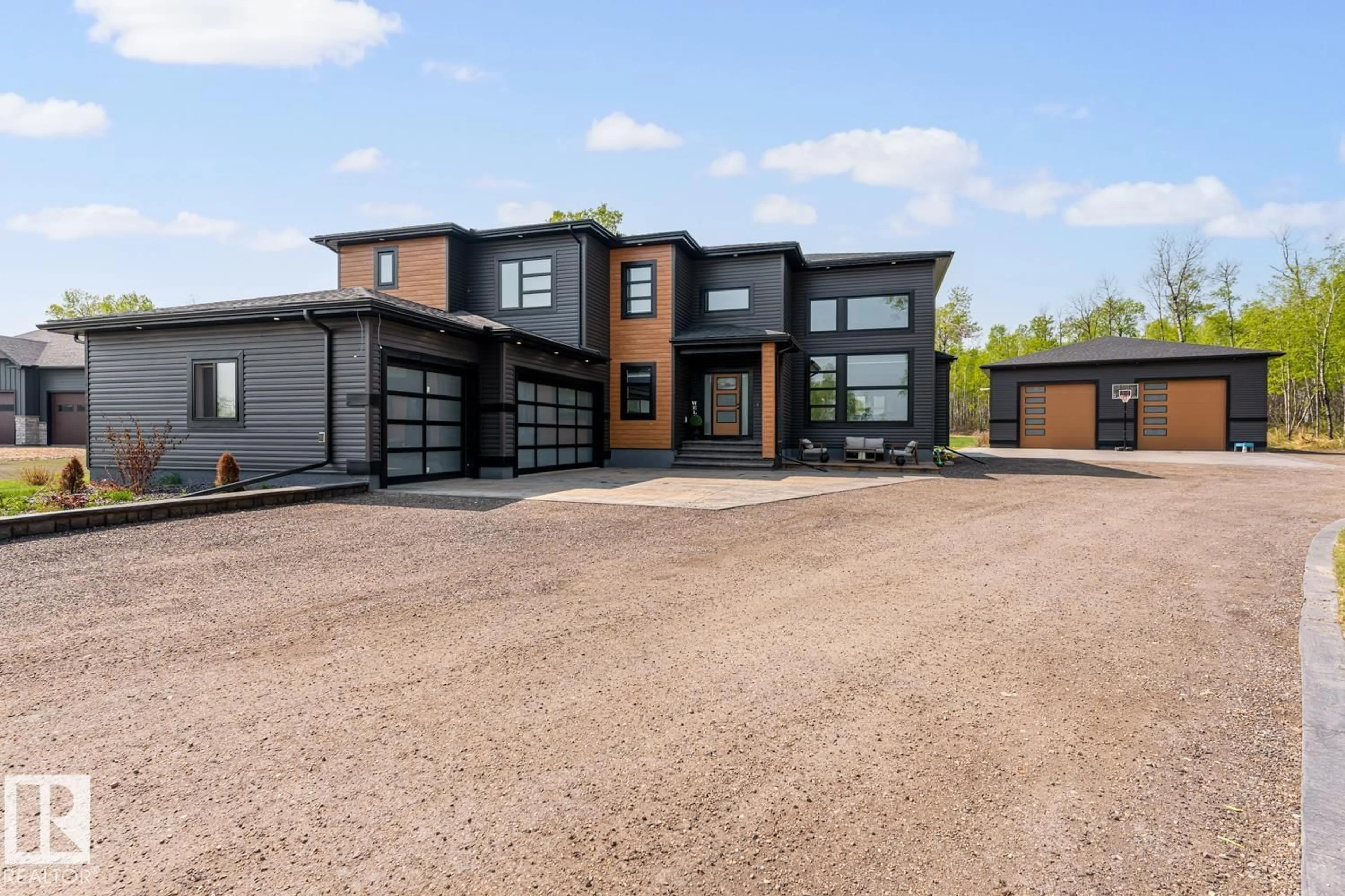 Home with brick exterior material, street for 125 42324 TWP 632 RD, Rural Bonnyville M.D. Alberta T9M1P2