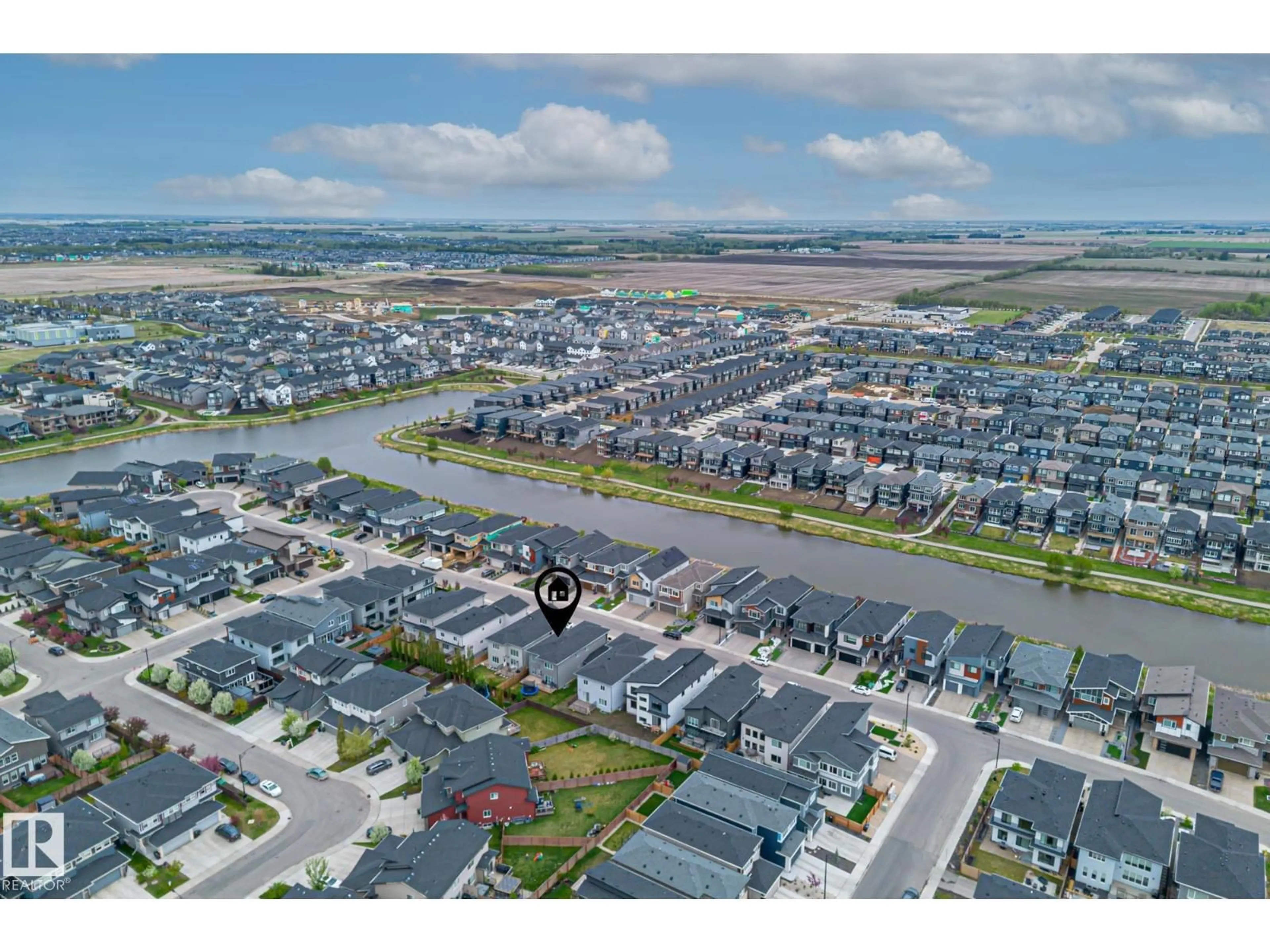 A pic from outside/outdoor area/front of a property/back of a property/a pic from drone, water/lake/river/ocean view for SW - 3116 KOSTASH GREEN GR, Edmonton Alberta T6W4K3