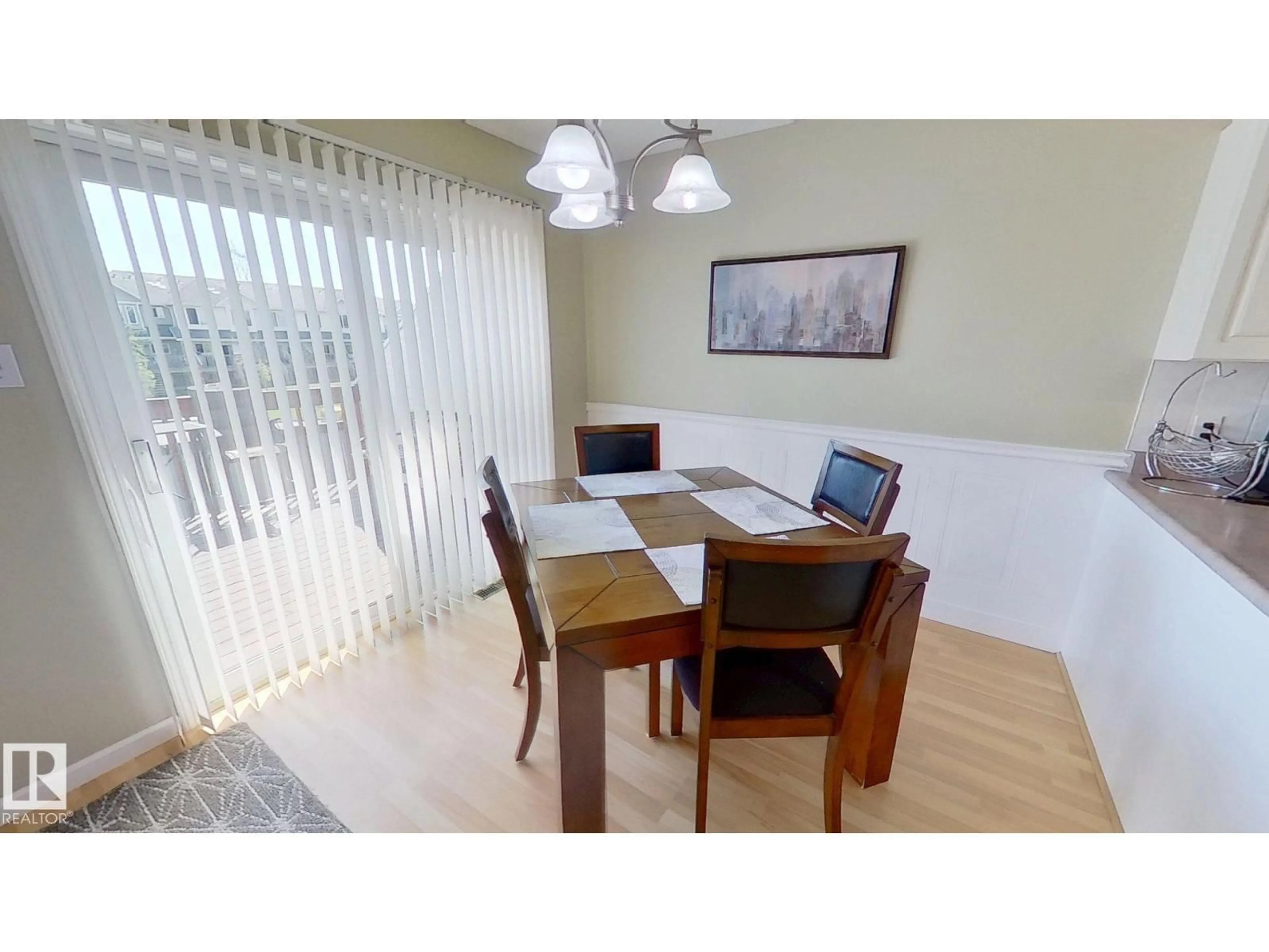 Dining room, wood/laminate floor for #12 - 13217 155 AV, Edmonton Alberta T6V1E6