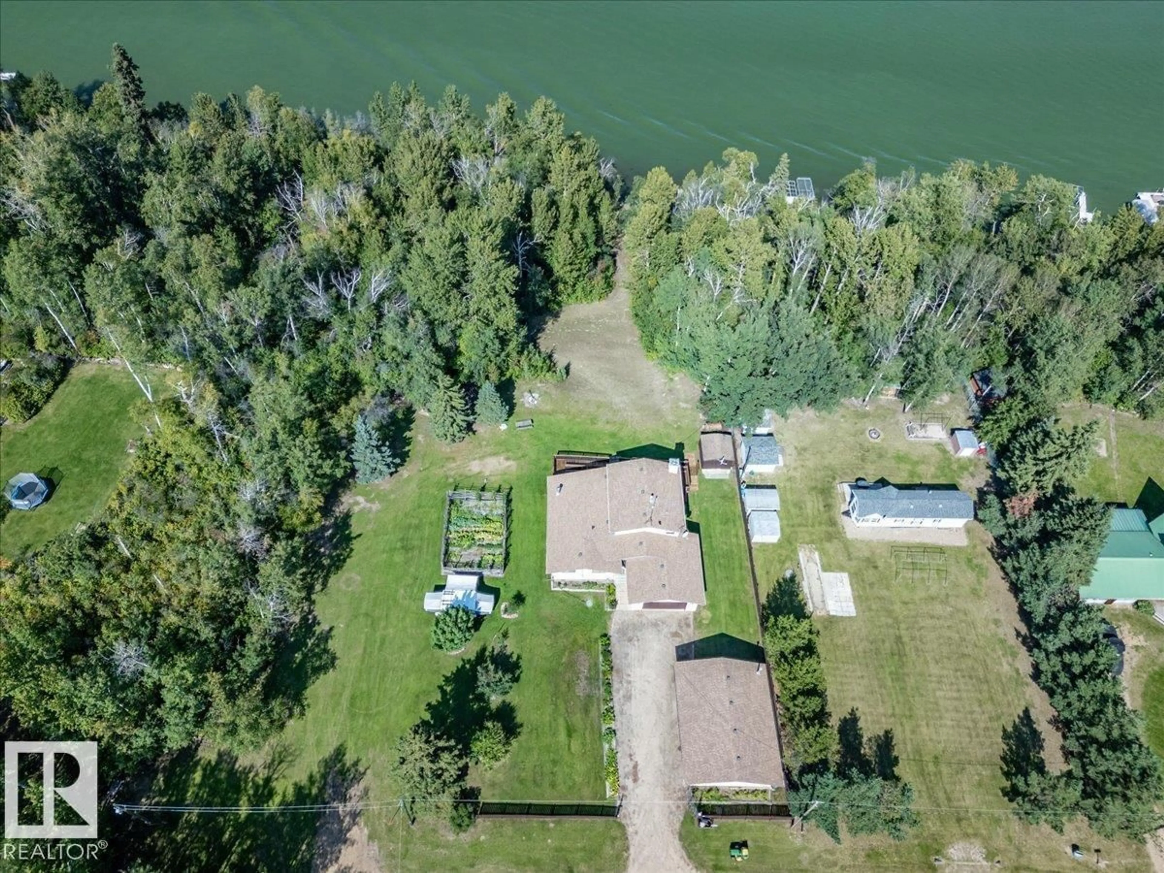 A pic from outside/outdoor area/front of a property/back of a property/a pic from drone, water/lake/river/ocean view for 271022 - 214 TWP ROAD 480, Rural Wetaskiwin County Alberta T0C0V0
