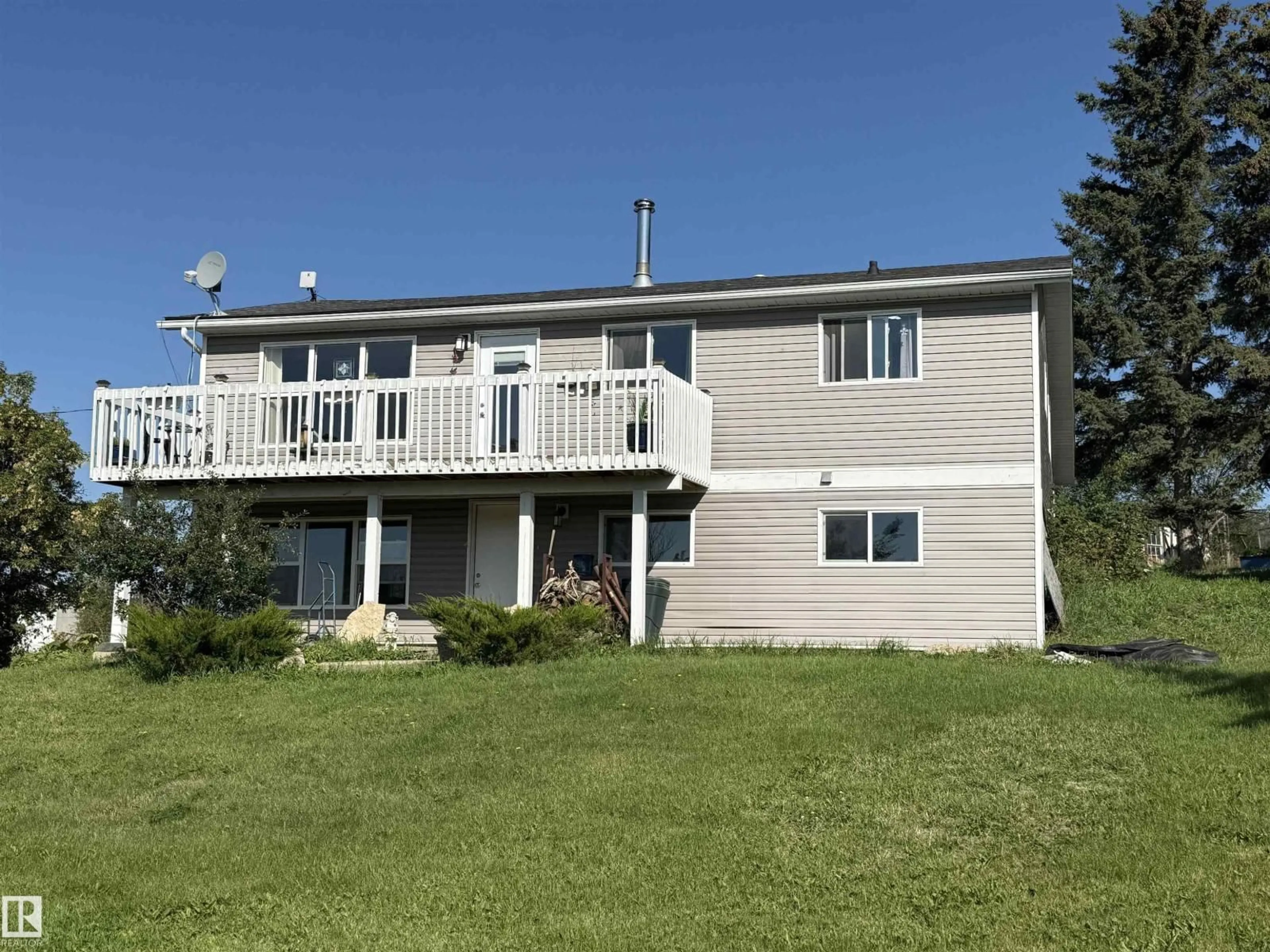 A pic from outside/outdoor area/front of a property/back of a property/a pic from drone, water/lake/river/ocean view for 56024 RGE RD 13, Rural Lac Ste. Anne County Alberta T0E1V0