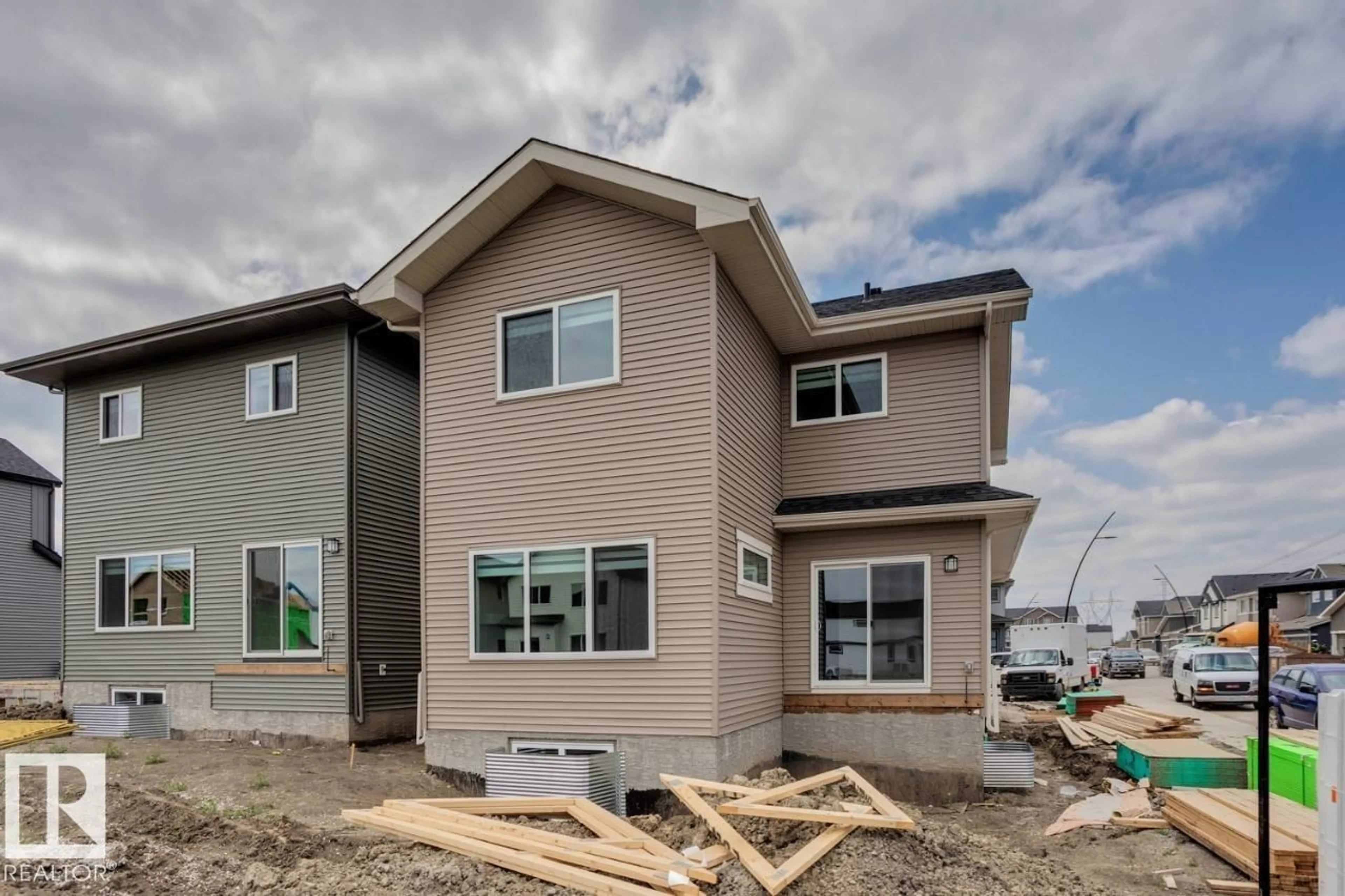 Home with vinyl exterior material, street for 2831 191 ST, Edmonton Alberta T6M3C3