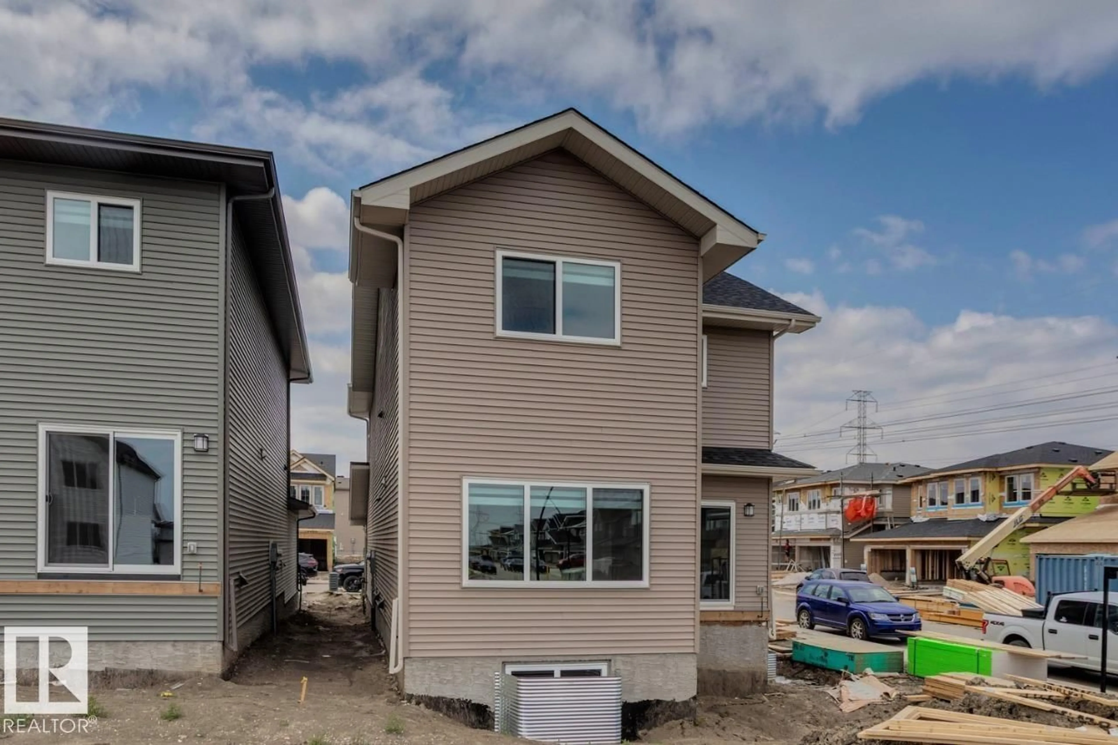 Home with vinyl exterior material, street for 2831 191 ST, Edmonton Alberta T6M3C3