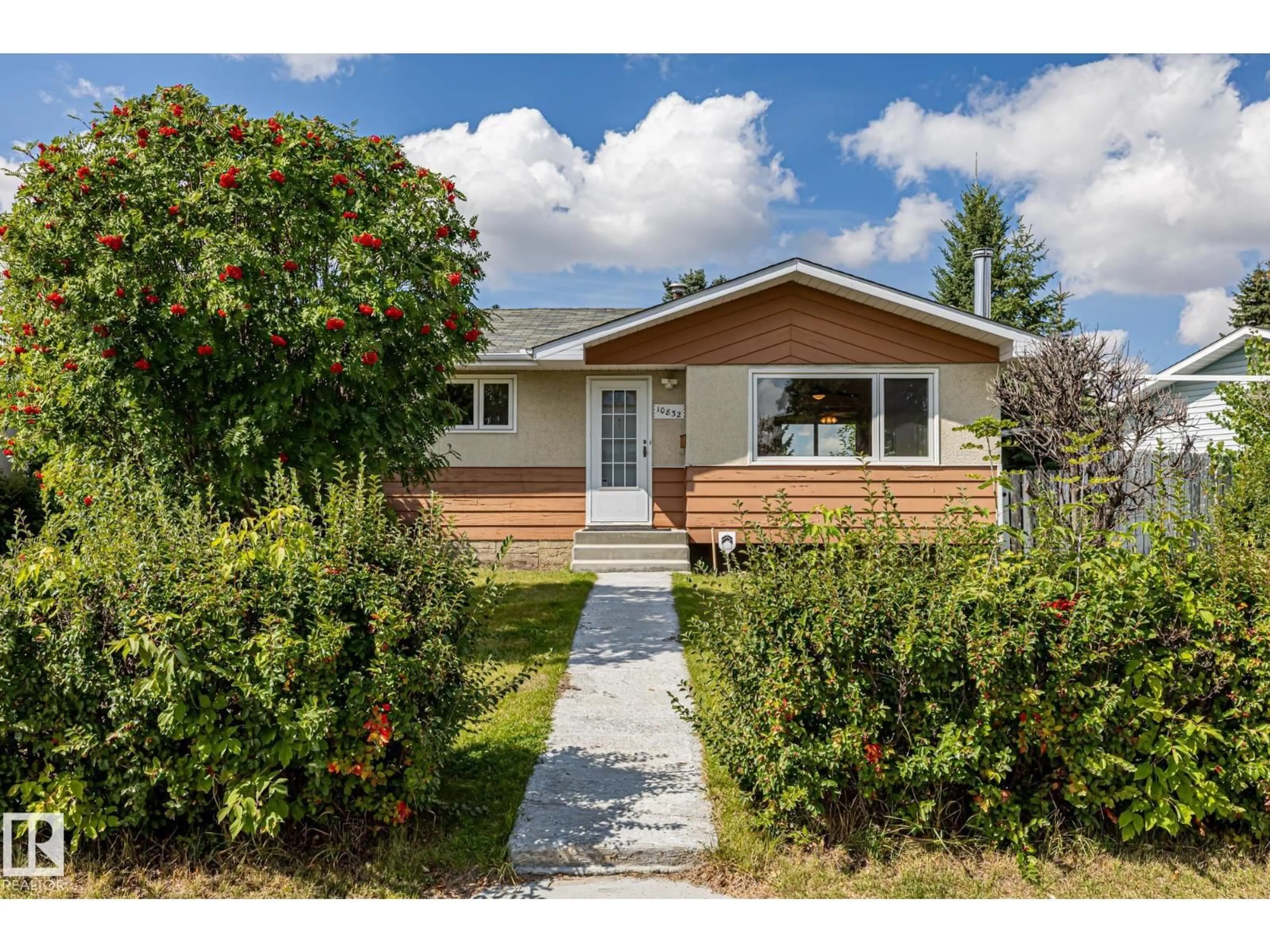 Home with vinyl exterior material, street for 10832 31 ST, Edmonton Alberta T5W1W7