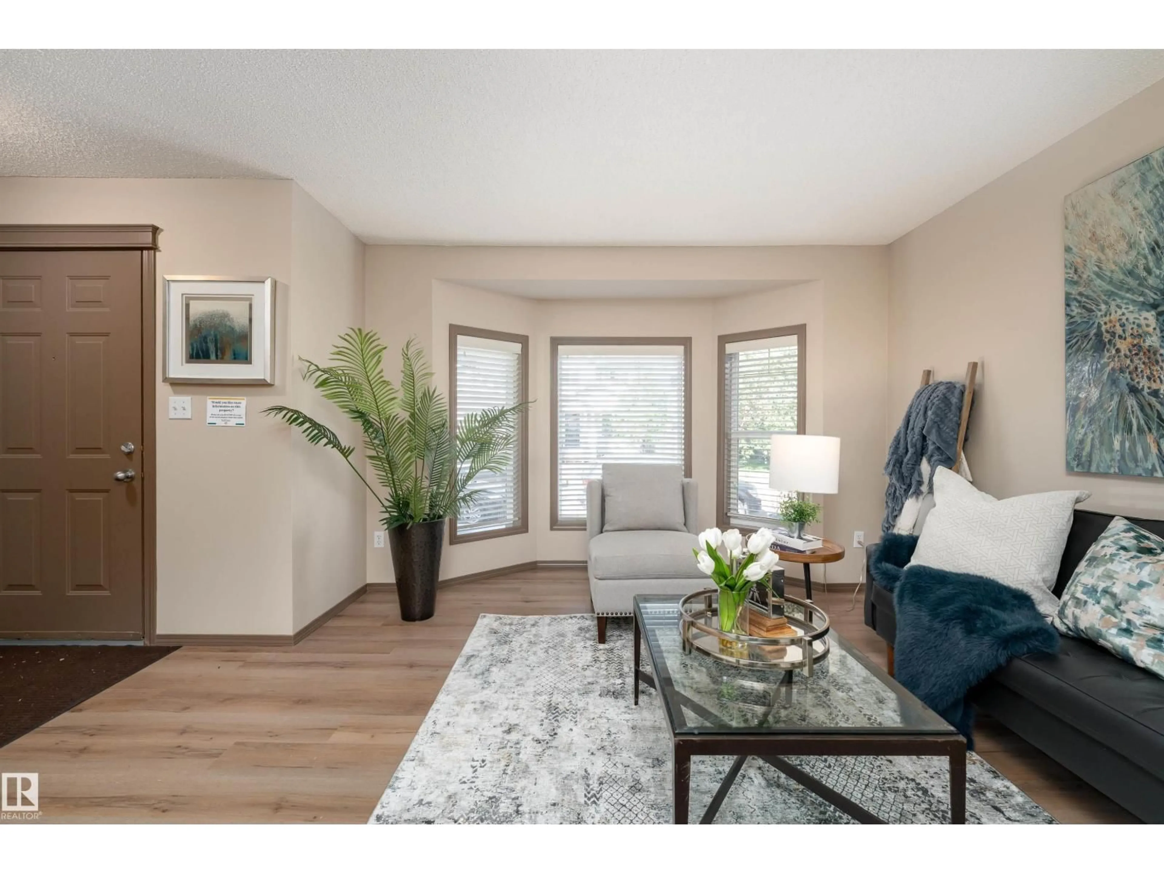Living room with furniture, wood/laminate floor for 625 88A ST, Edmonton Alberta T6X1C3
