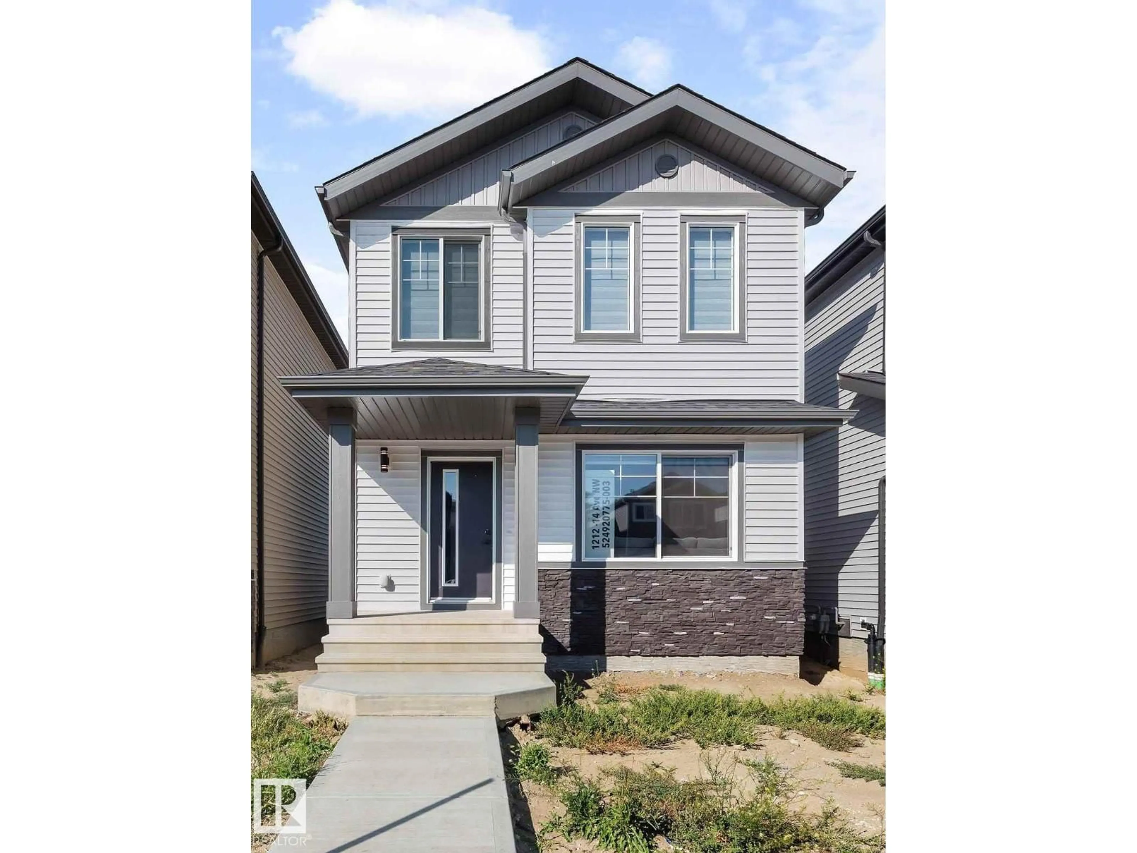 Home with vinyl exterior material, street for 1212 14 AV, Edmonton Alberta T6T2W2