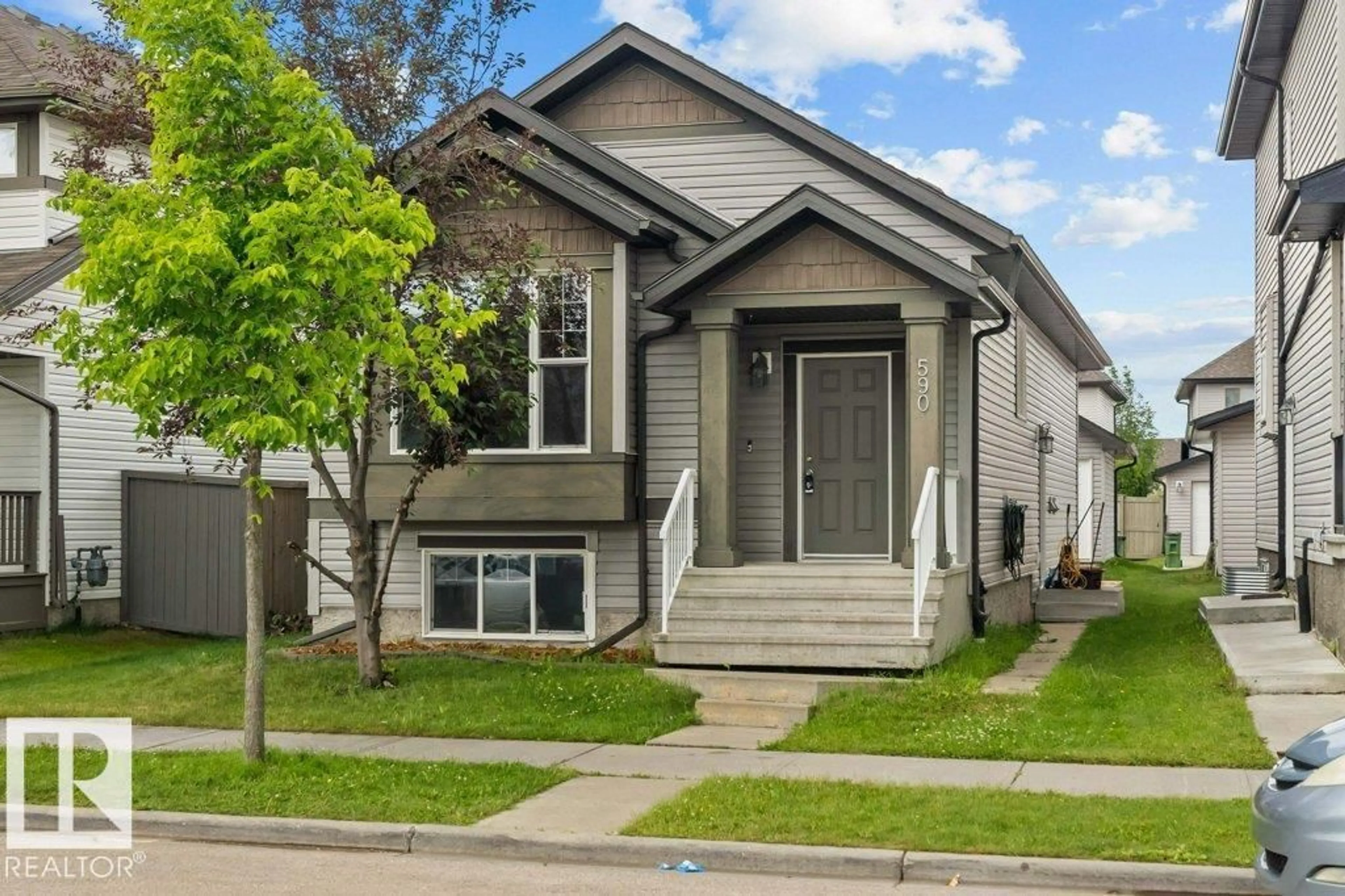 Home with vinyl exterior material, street for 590 TAMARACK RD, Edmonton Alberta T6T0M8