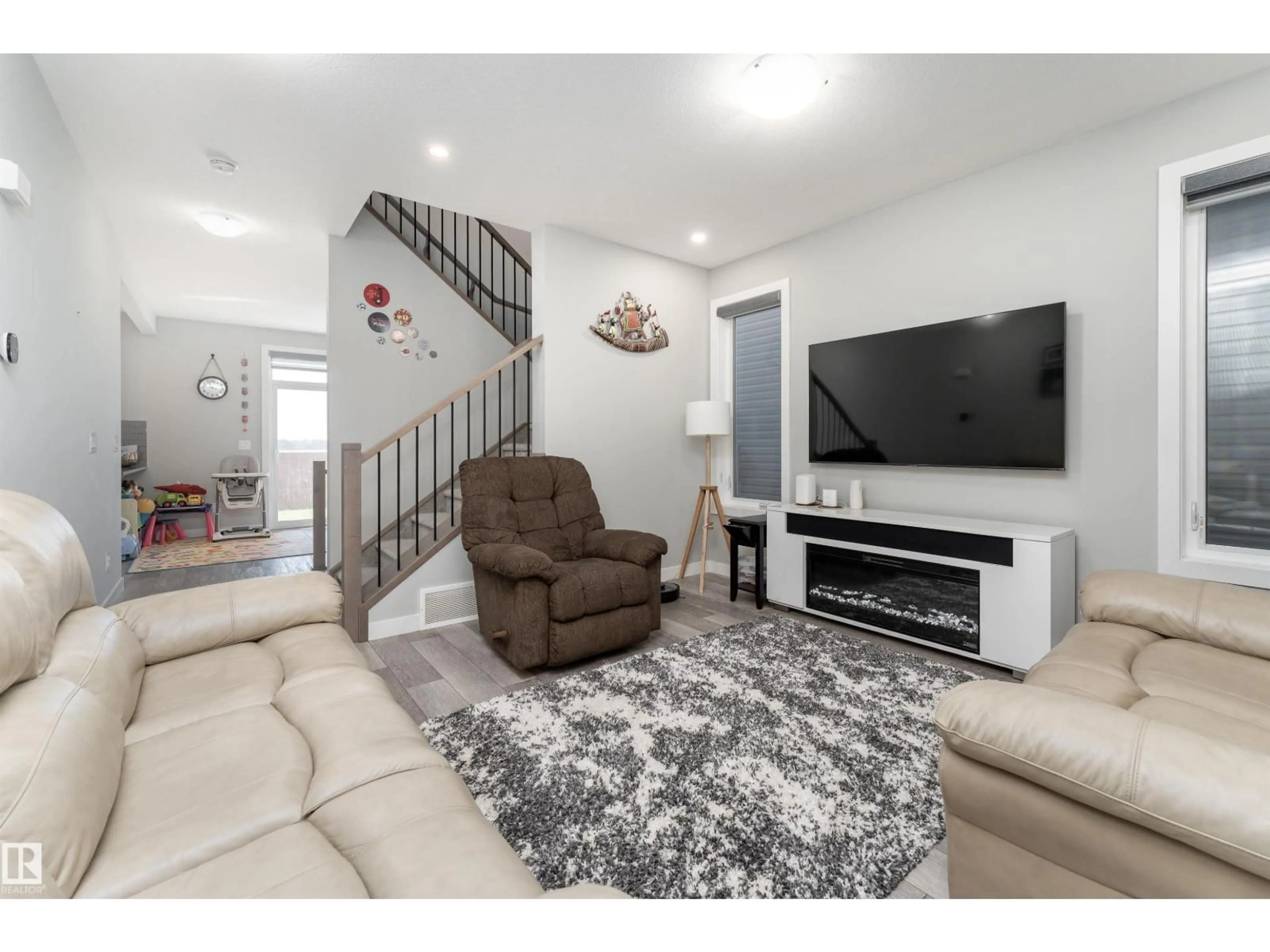 Living room with furniture, unknown for 20115 15 AV, Edmonton Alberta T6M1L6
