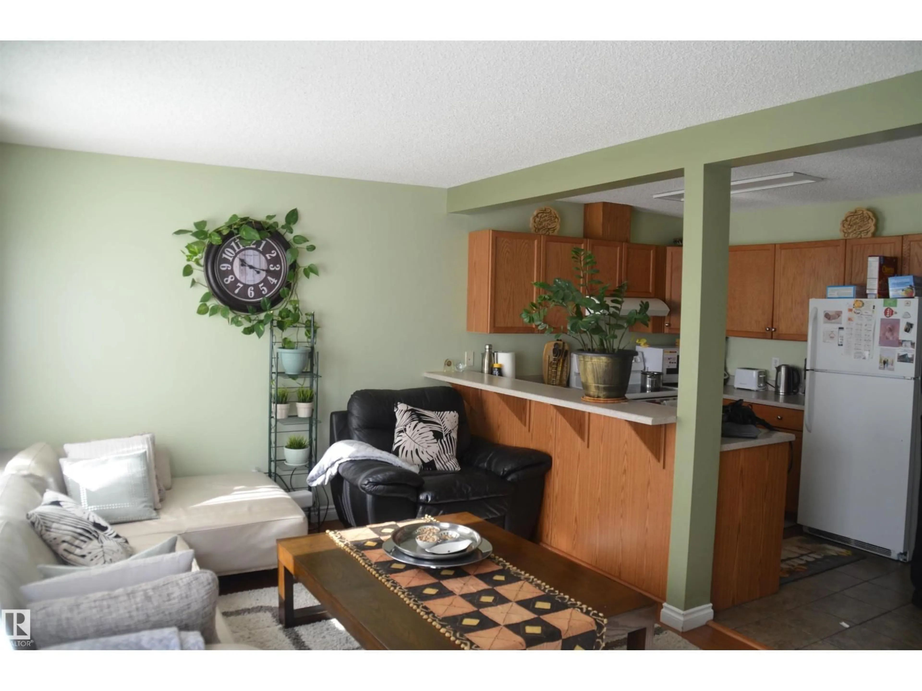 Living room with furniture, wood/laminate floor for NW - 25 14603 MILLER BV, Edmonton Alberta T5Y3B6
