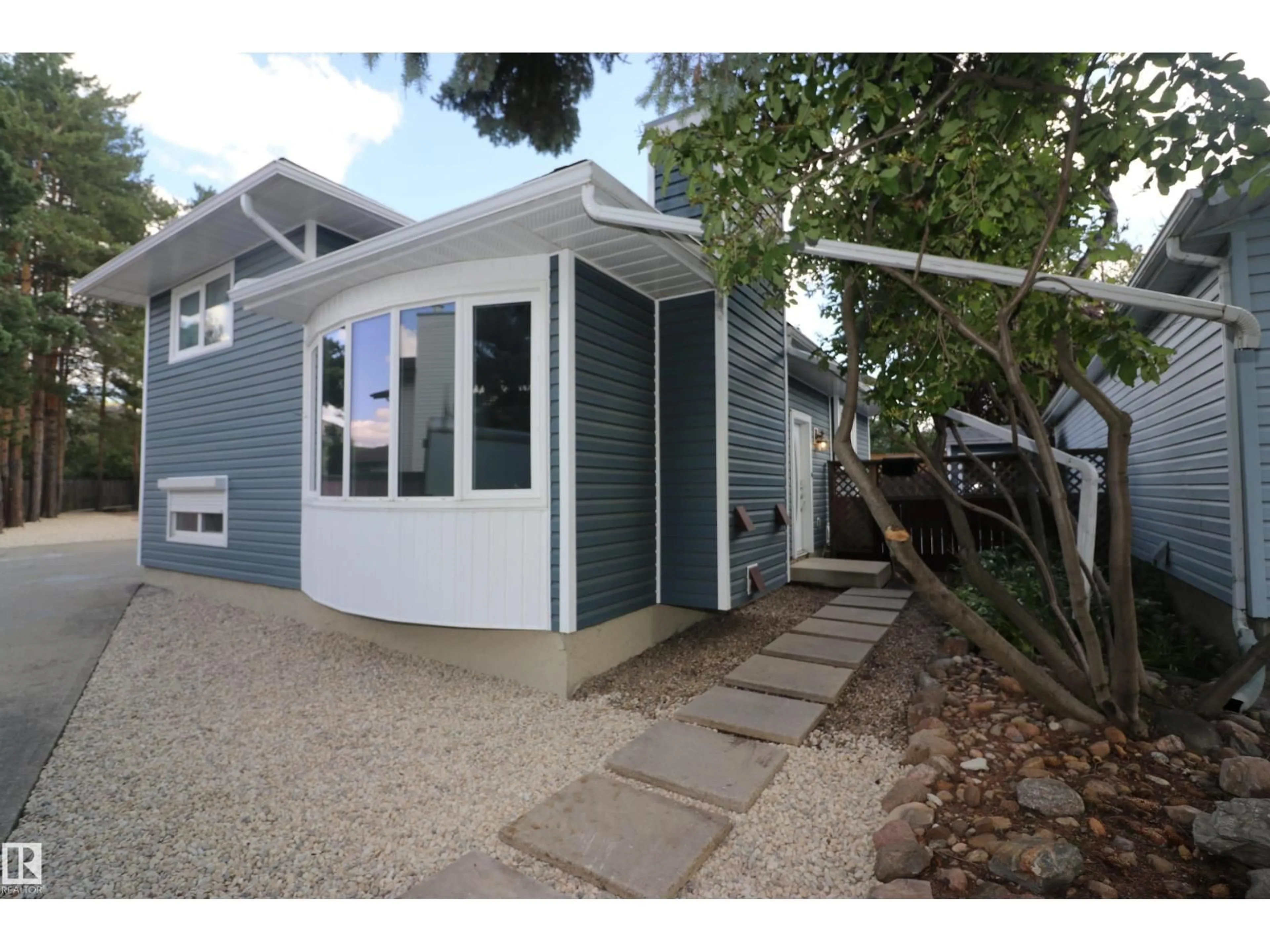 Home with vinyl exterior material, street for 4319 54 ST, Beaumont Alberta T4X1L6