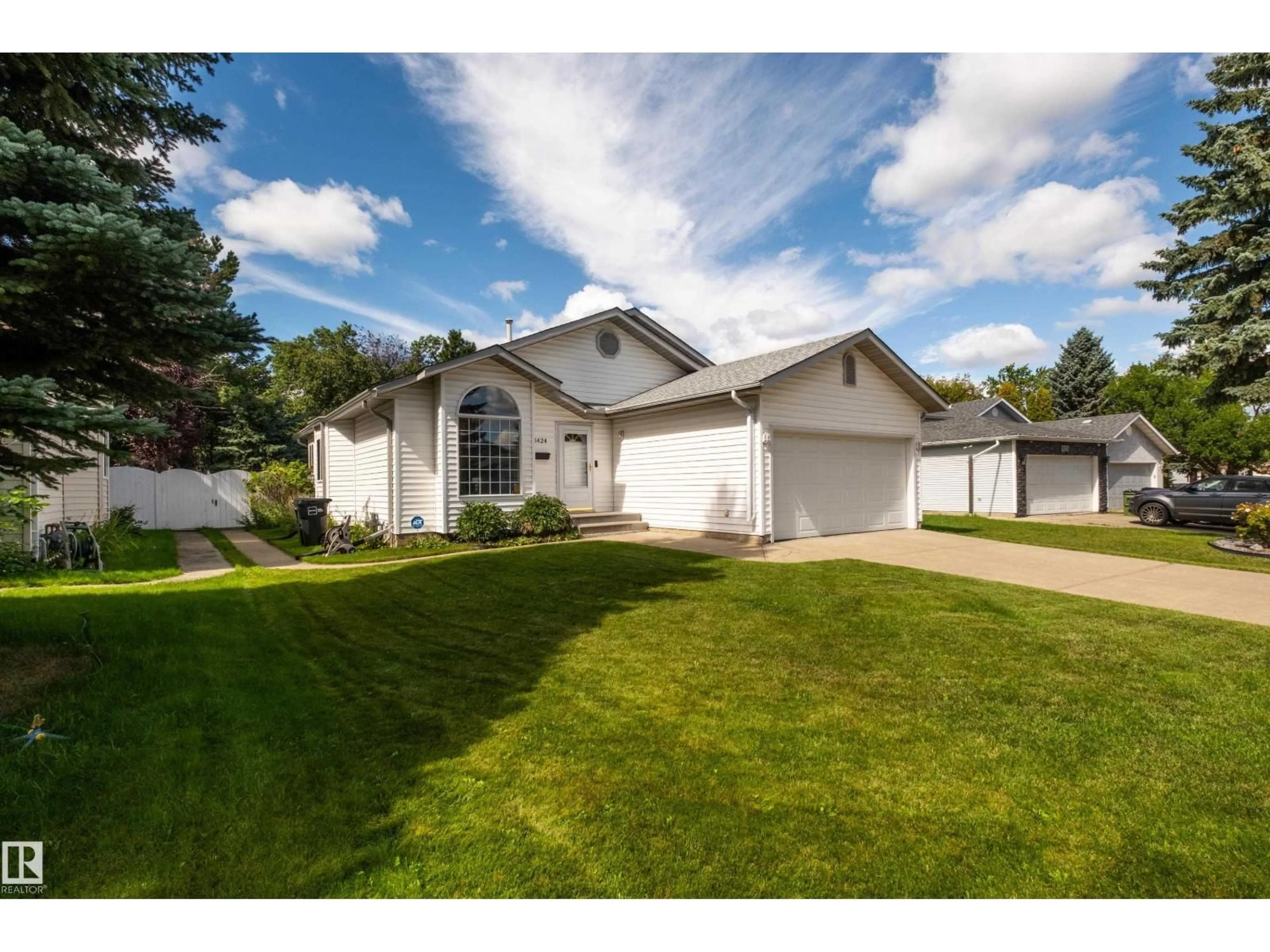 Home with vinyl exterior material, street for NW - 1424 48A ST, Edmonton Alberta T6L6H9