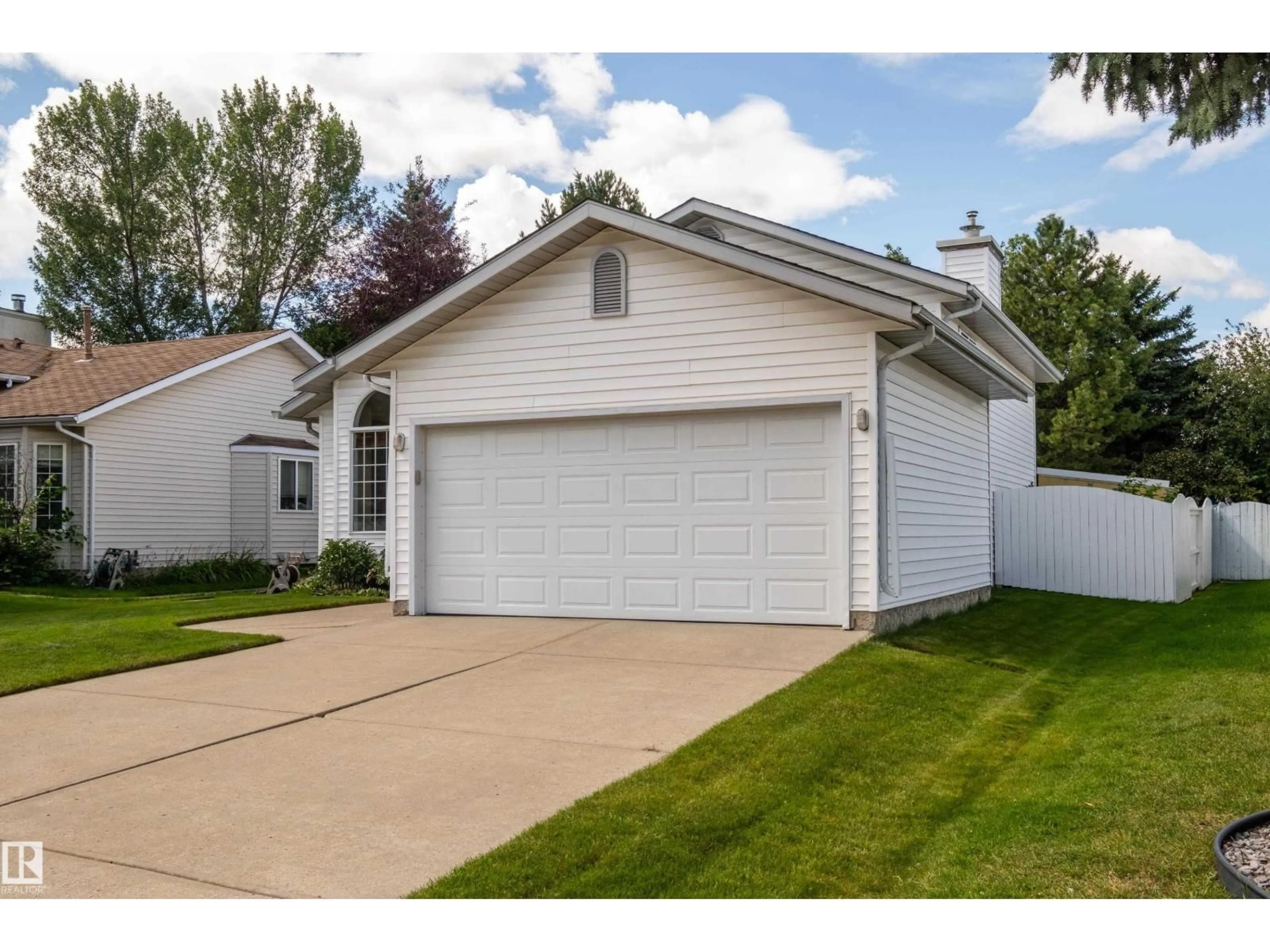 Home with vinyl exterior material, street for NW - 1424 48A ST, Edmonton Alberta T6L6H9