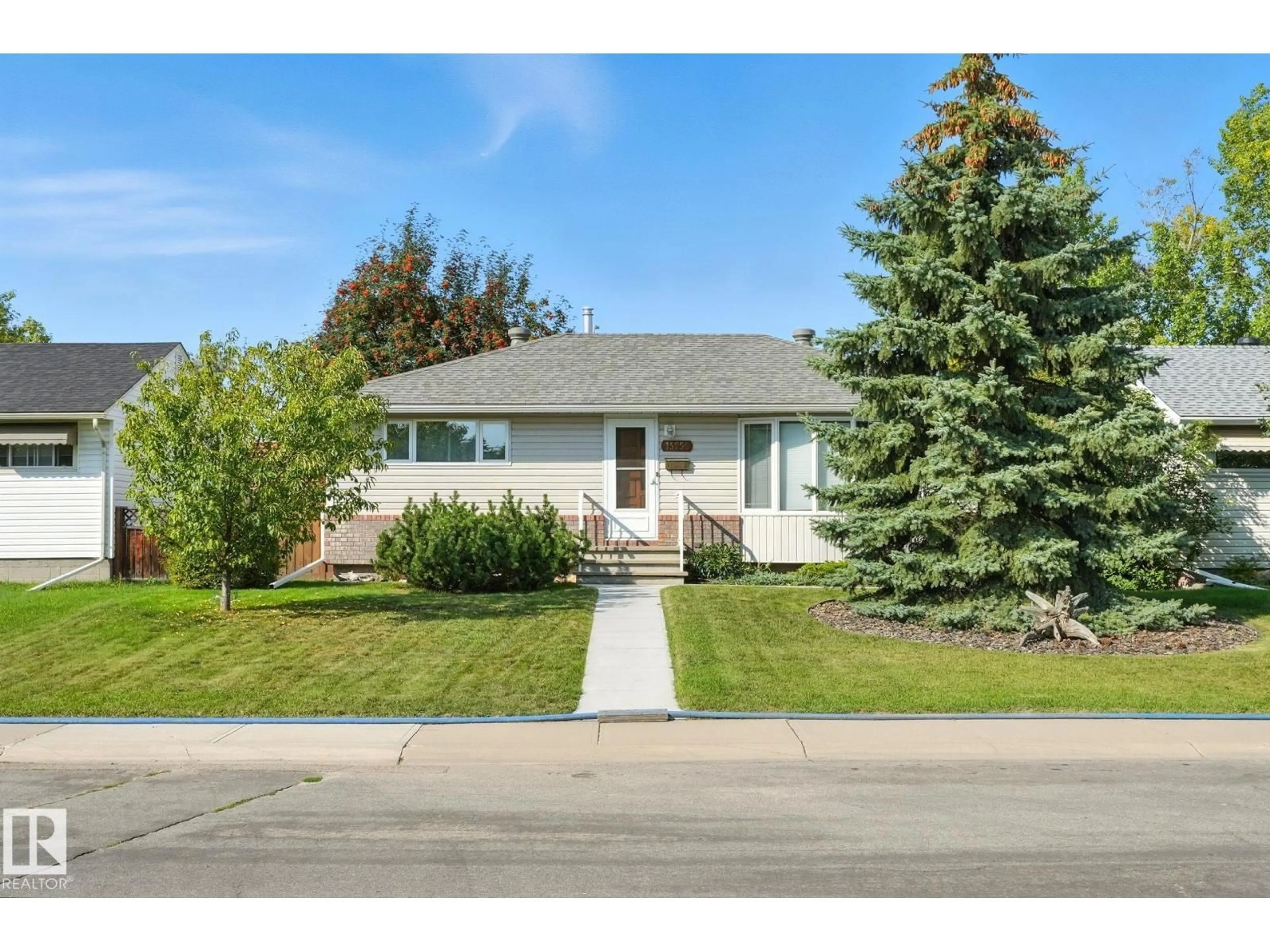 Home with vinyl exterior material, street for NW - 15956 110B AV, Edmonton Alberta T5P1J4