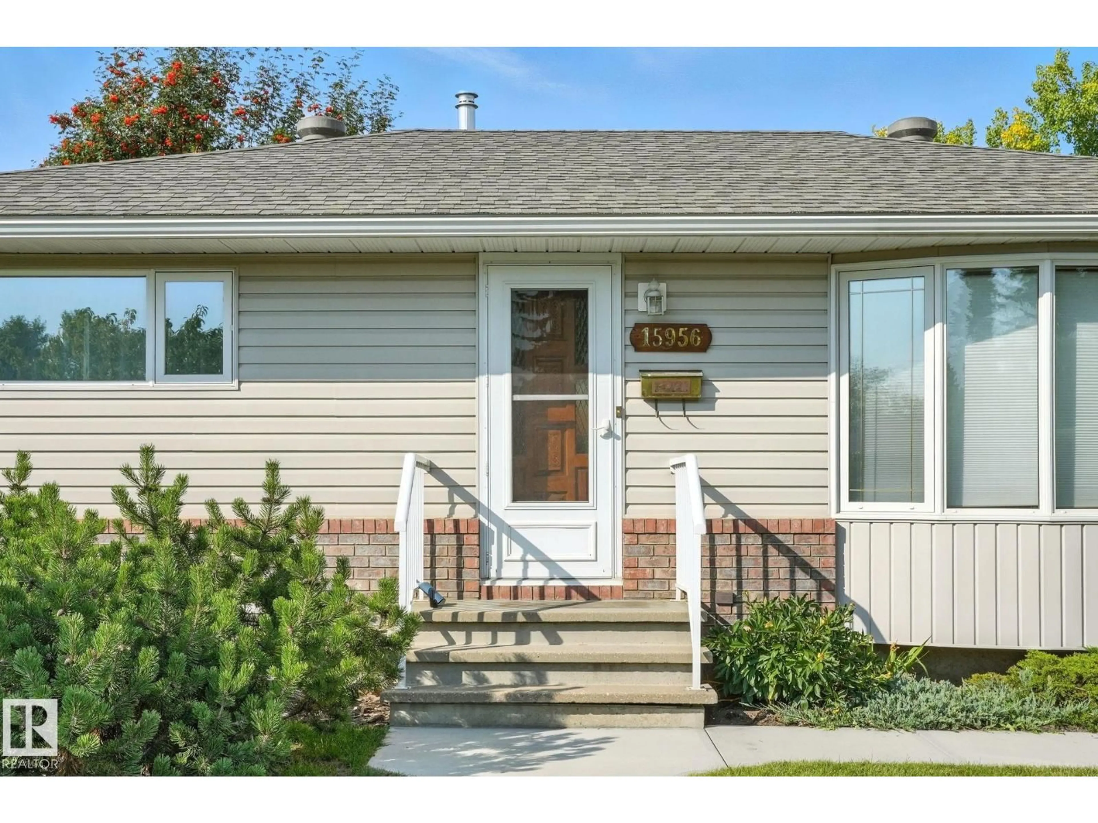 Home with vinyl exterior material, street for NW - 15956 110B AV, Edmonton Alberta T5P1J4