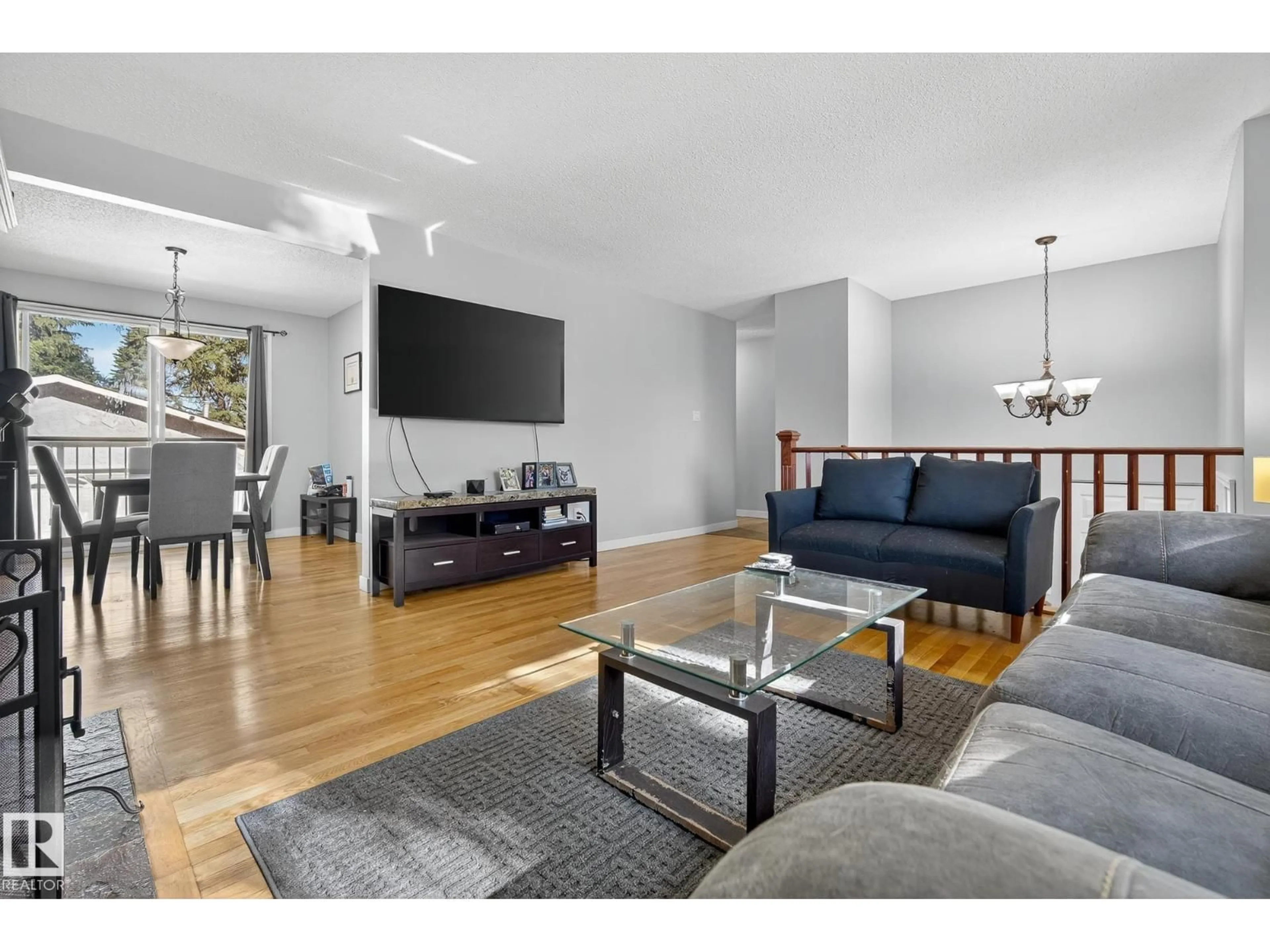 Living room with furniture, wood/laminate floor for 2 FARMSTEAD AV, St. Albert Alberta T8N1V8